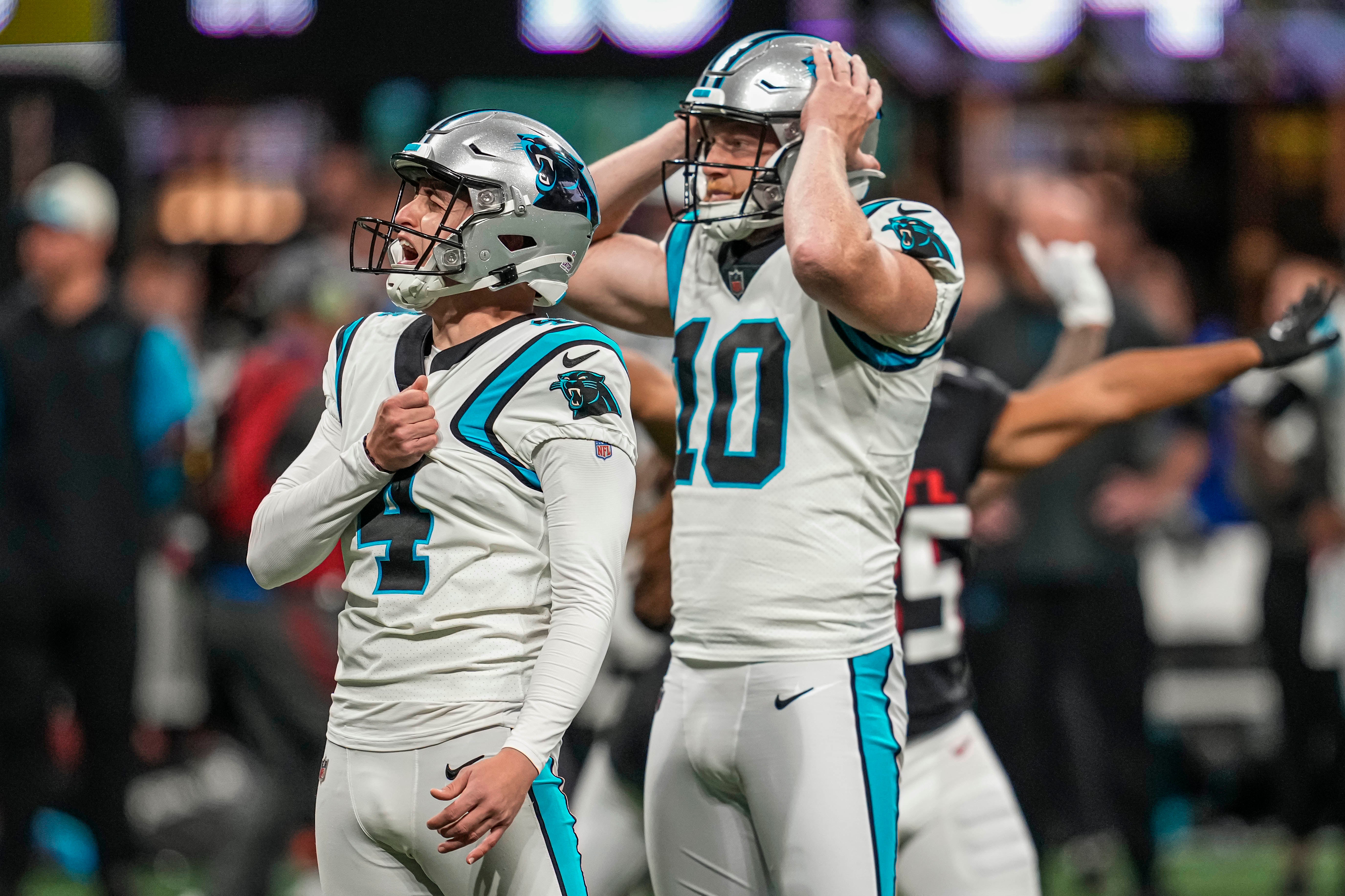 Oct 30, 2022; Atlanta, Georgia, USA; Carolina Panthers place kicker Eddy Pineiro (4) and punter Johnny Hekker (10) react after Pineiro missed a field goal against the Atlanta Falcons during overtime at Mercedes-Benz Stadium. Mandatory Credit: Dale Zanine-USA TODAY Sports