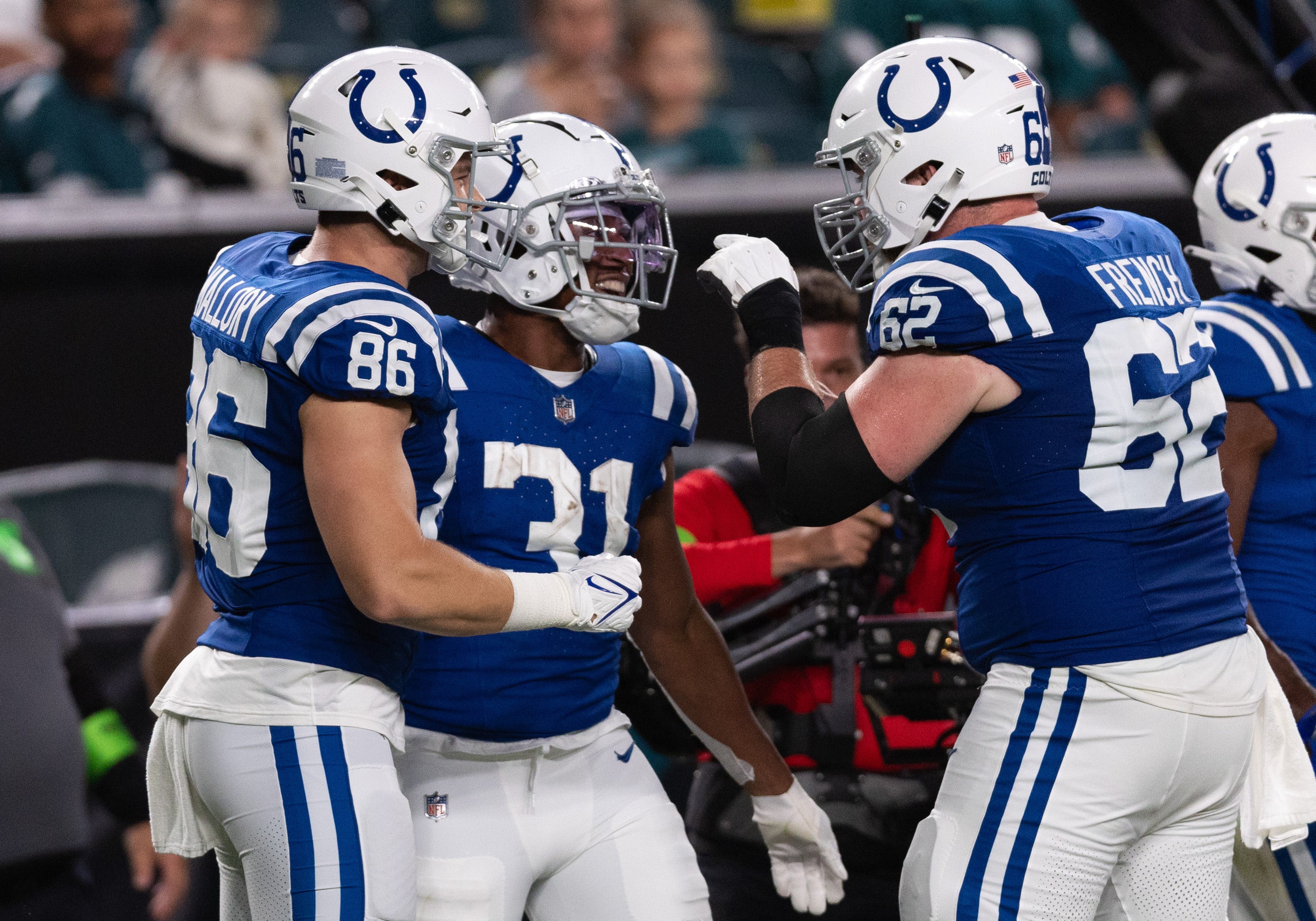 Aug 24, 2023; Philadelphia, Pennsylvania, USA; Indianapolis Colts running back Kenyan Drake (31) celebrates with center Wesley French (62) and tight end Will Mallory (86) after his touchdown against the Philadelphia Eagles during the third quarter at Lincoln Financial Field.