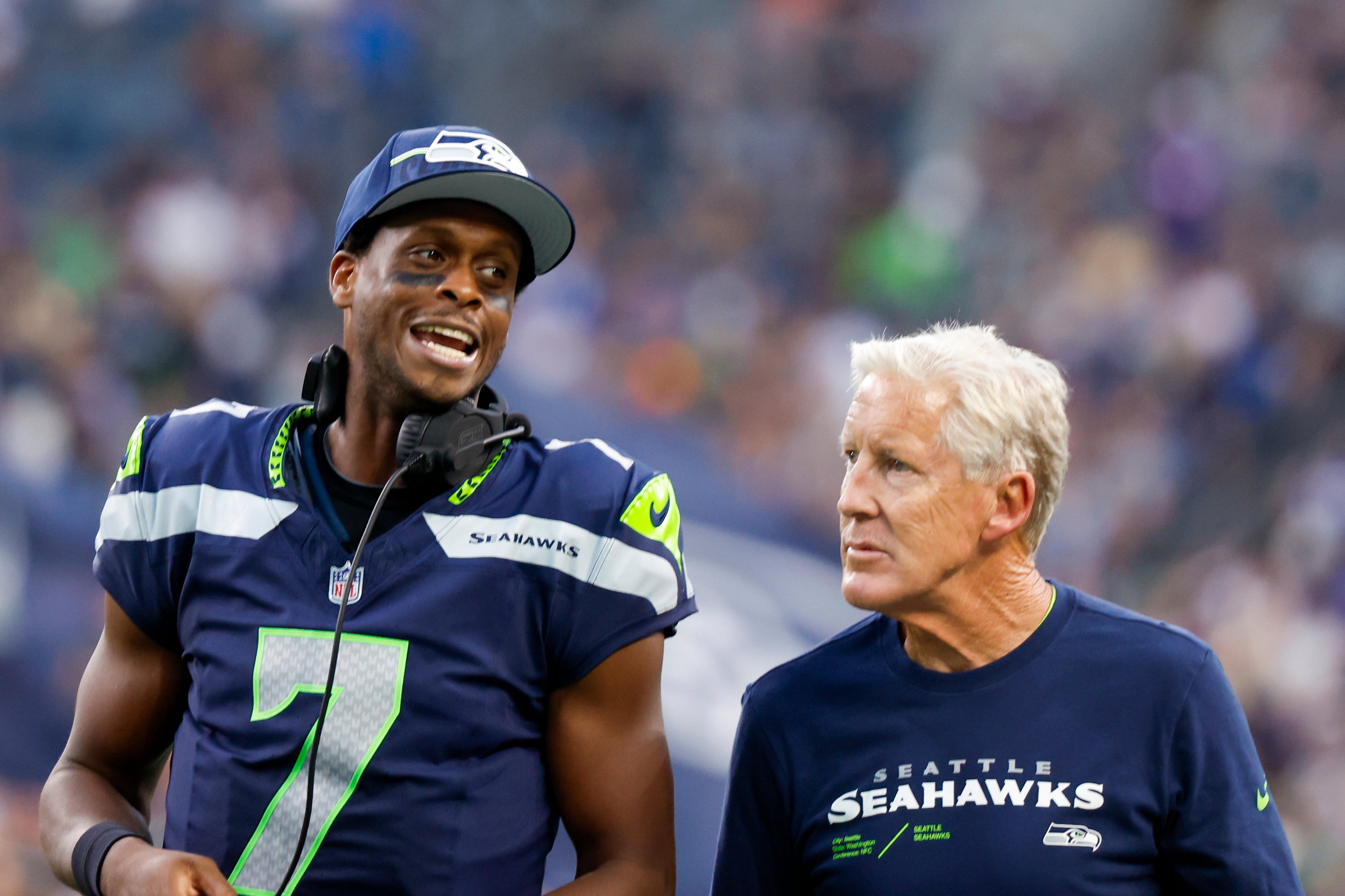 Aug 19, 2023; Seattle, Washington, USA; Seattle Seahawks quarterback Geno Smith (7) talks with head coach Pete Carroll during the second quarter against the Dallas Cowboys at Lumen Field. Mandatory Credit: Joe Nicholson-USA TODAY Sports