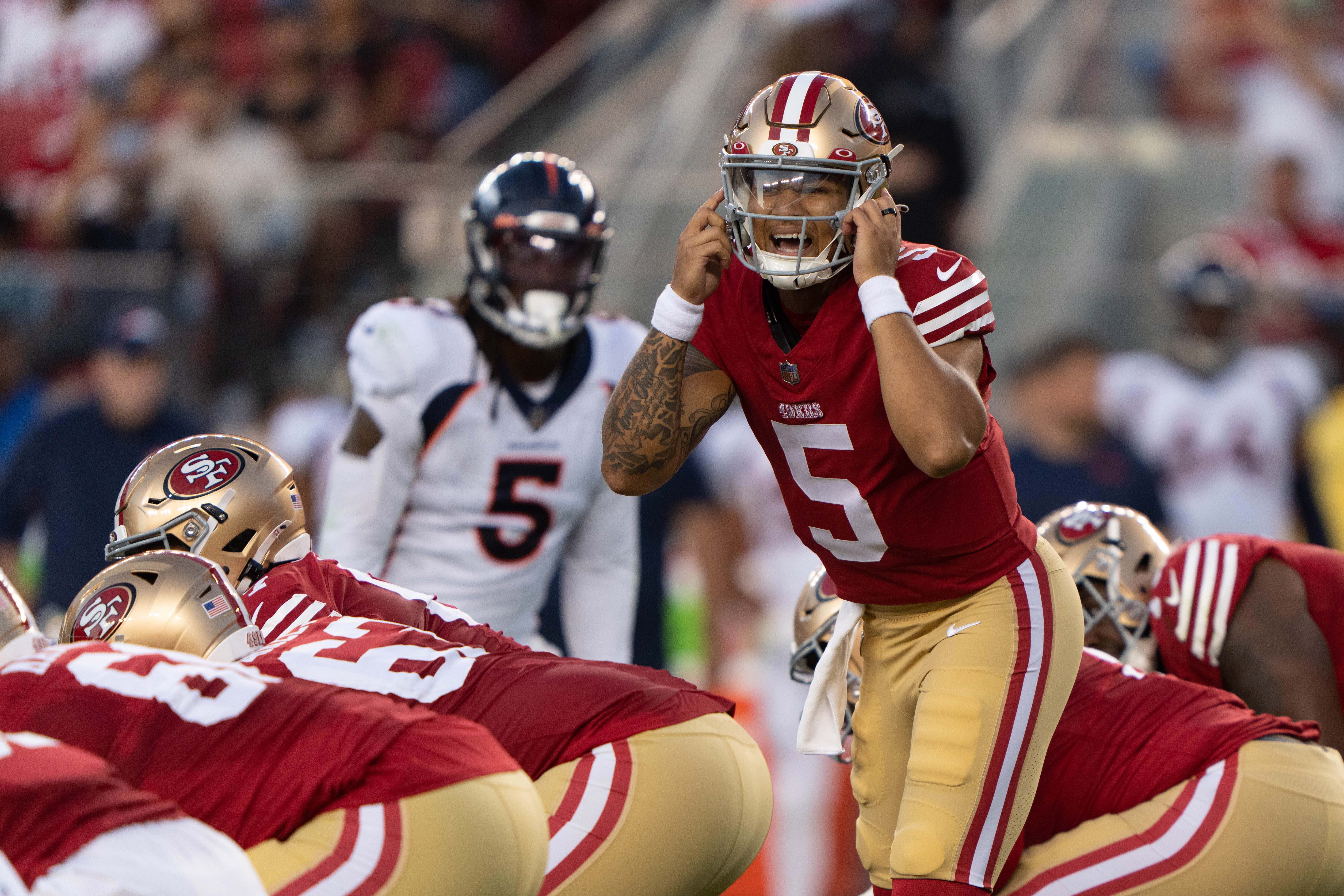 Aug 19, 2023; Santa Clara, California, USA; San Francisco 49ers quarterback Trey Lance (5) signals during the third quarter against the Denver Broncos at Levi's Stadium. Mandatory Credit: Stan Szeto-USA TODAY Sports