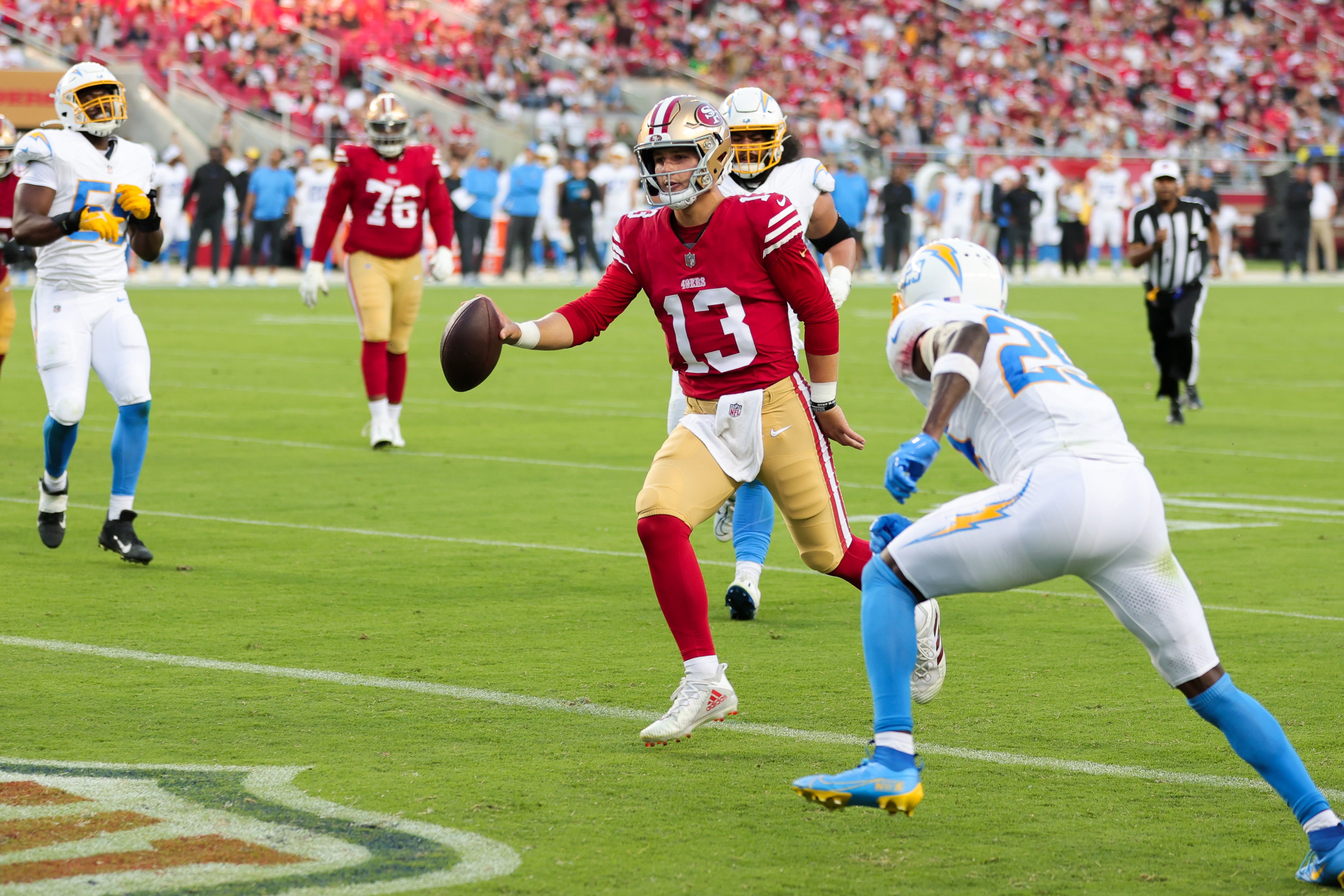 Aug 25, 2023; Santa Clara, California, USA; San Francisco 49ers quarterback Brock Purdy (13) runs for a touchdown during the first quarter against the Los Angeles Chargers at Levi's Stadium. Mandatory Credit: Sergio Estrada-USA TODAY Sports