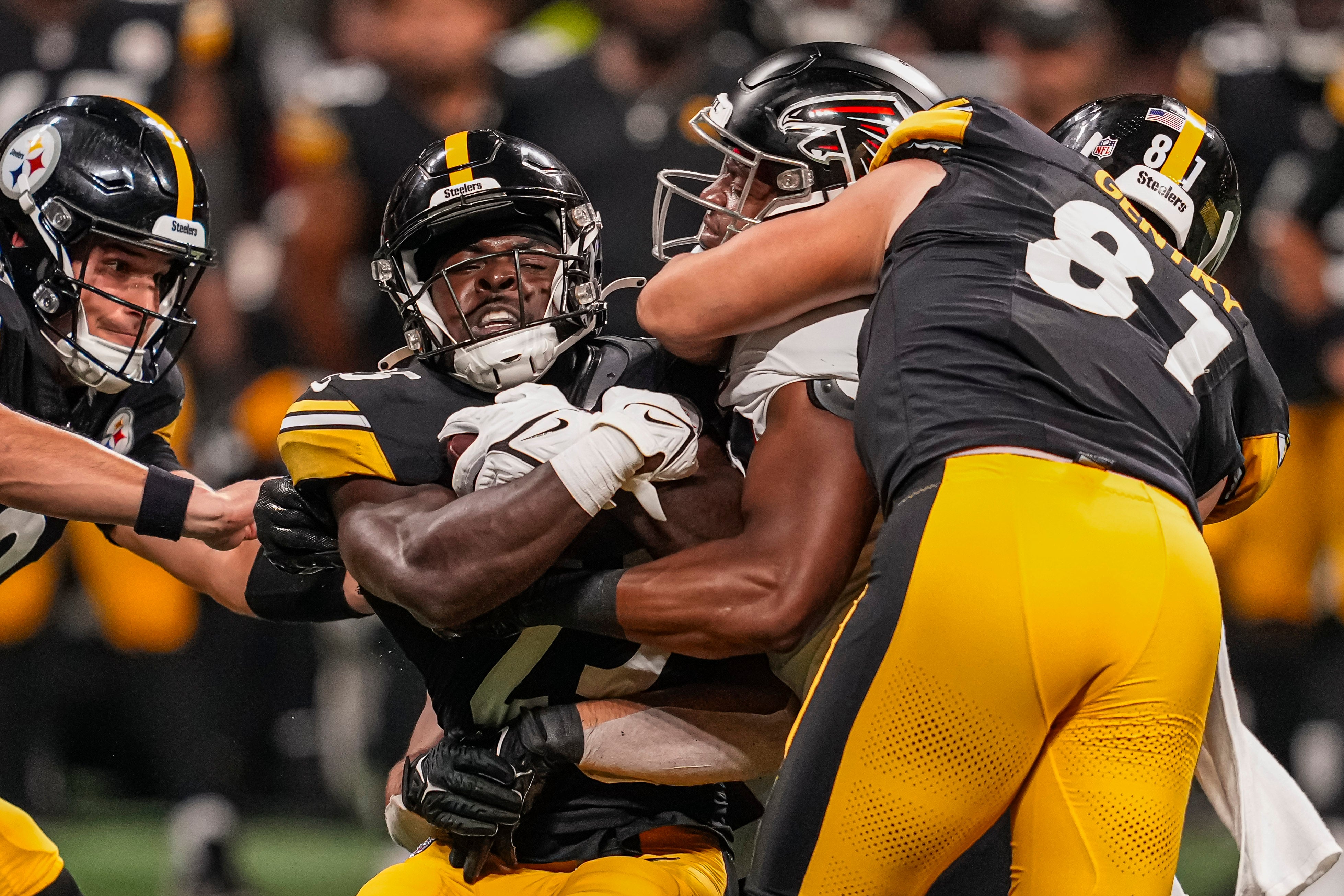 Aug 24, 2023; Atlanta, Georgia, USA; Pittsburgh Steelers running back Darius Hagans (25) is tackled by Atlanta Falcons defensive end Delontae Scott (73) during the second half at Mercedes-Benz Stadium. Mandatory Credit: Dale Zanine-USA TODAY Sports