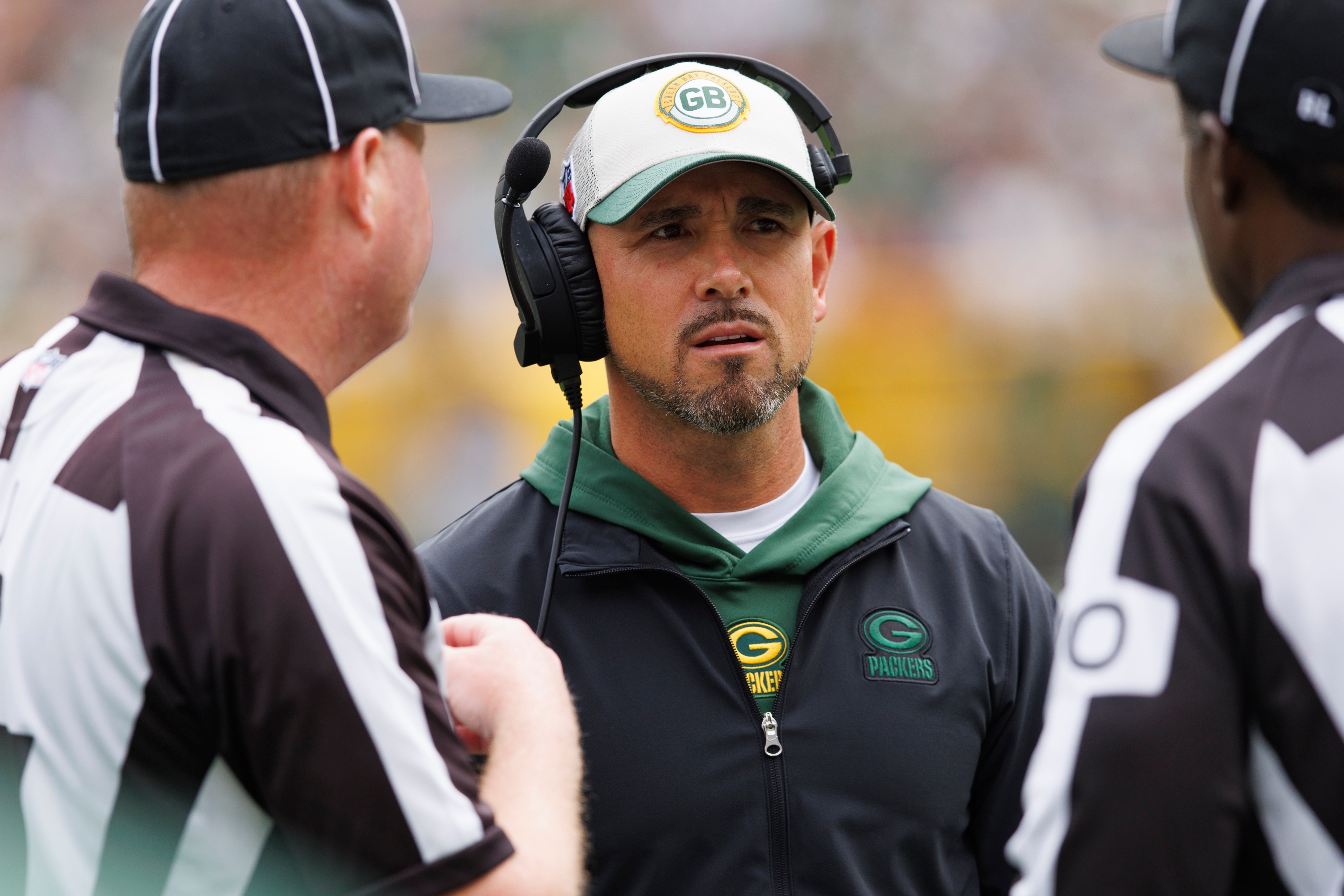 Aug 26, 2023; Green Bay, Wisconsin, USA; Green Bay Packers head coach Matt LaFleur talks with officials during the first quarter against the Seattle Seahawks at Lambeau Field. Jeff Hanisch-USA TODAY Sports
