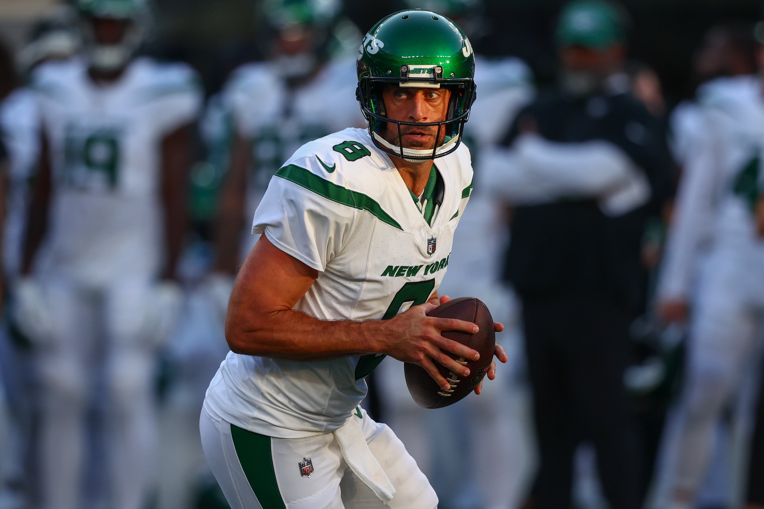 New York Jets quarterback Aaron Rodgers (8) runs with the ball against the New York Giants during the first half at MetLife Stadium.  Ed Mulholland-USA TODAY Sports