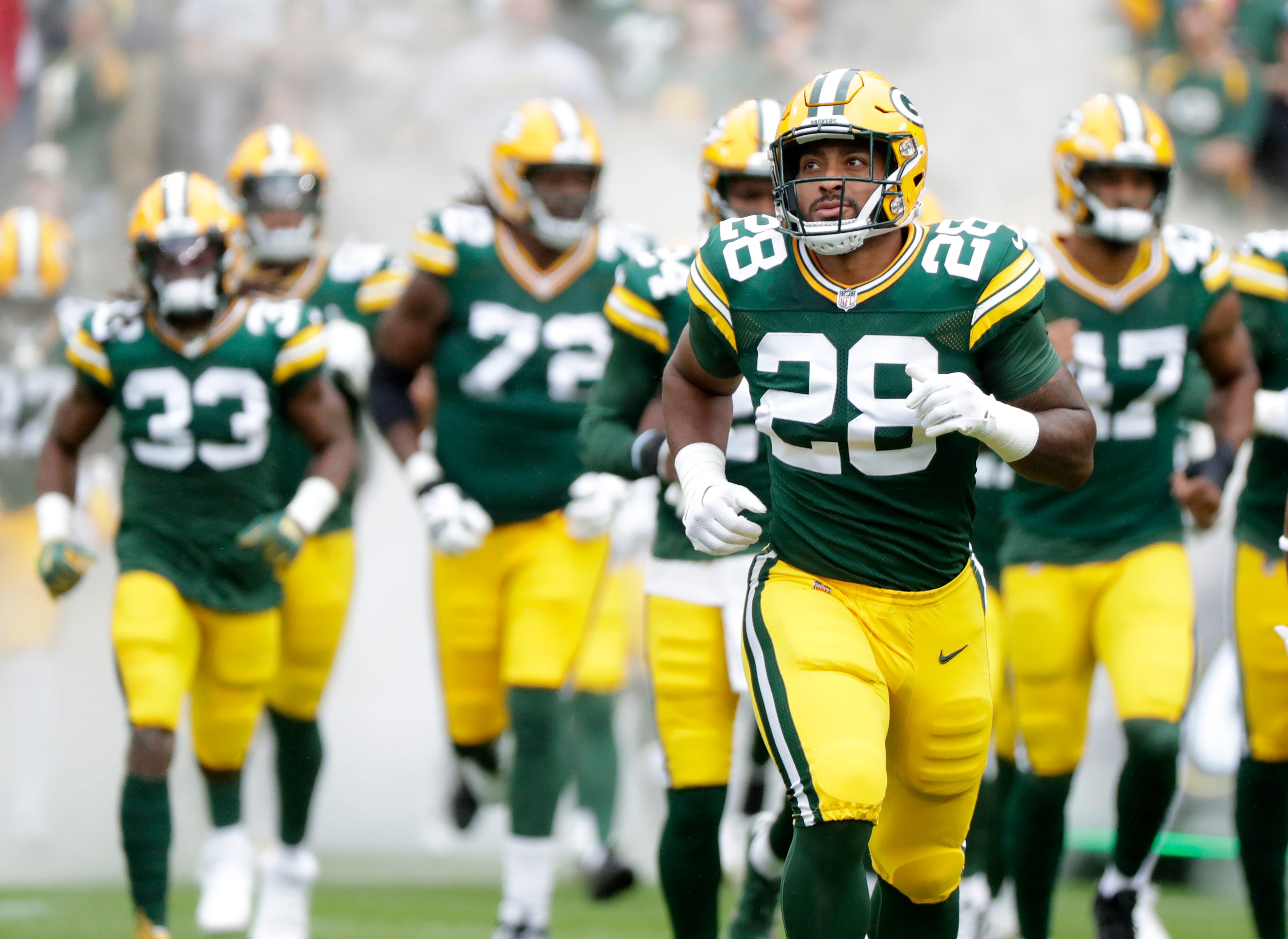 Green Bay Packers running back AJ Dillon (28) runs on the field at the start of a preseason football game against the Seattle Seahawks on Saturday, August 26, 2023, at Lambeau Field in Green Bay, Wis. Sarah Kloepping/USA TODAY NETWORK-Wisconsin / USA TODAY NETWORK