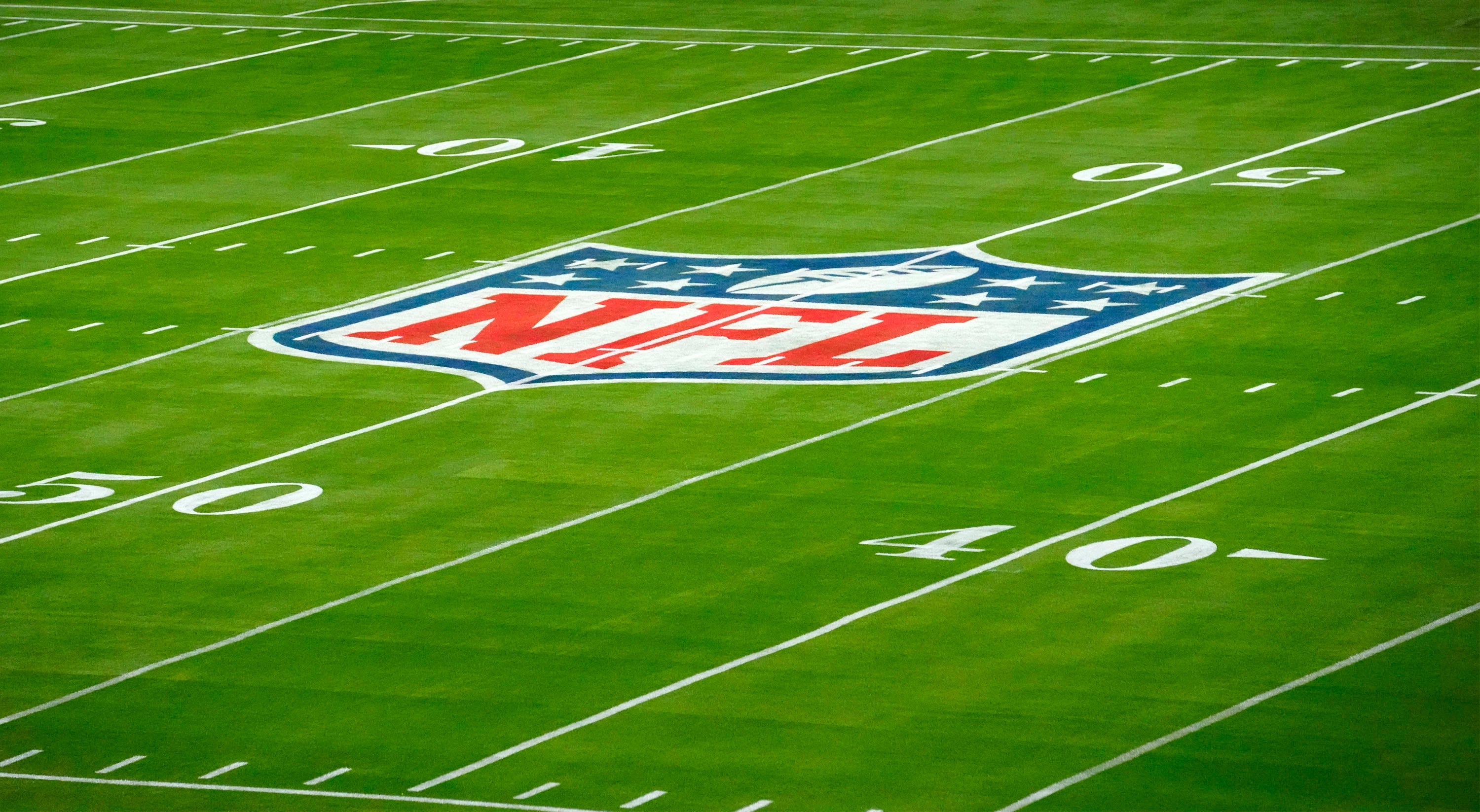 The NFL logo is seen on Jan. 31, 2023, on the field for Super Bowl LVII at State Farm Stadium. Syndication Arizona Republic