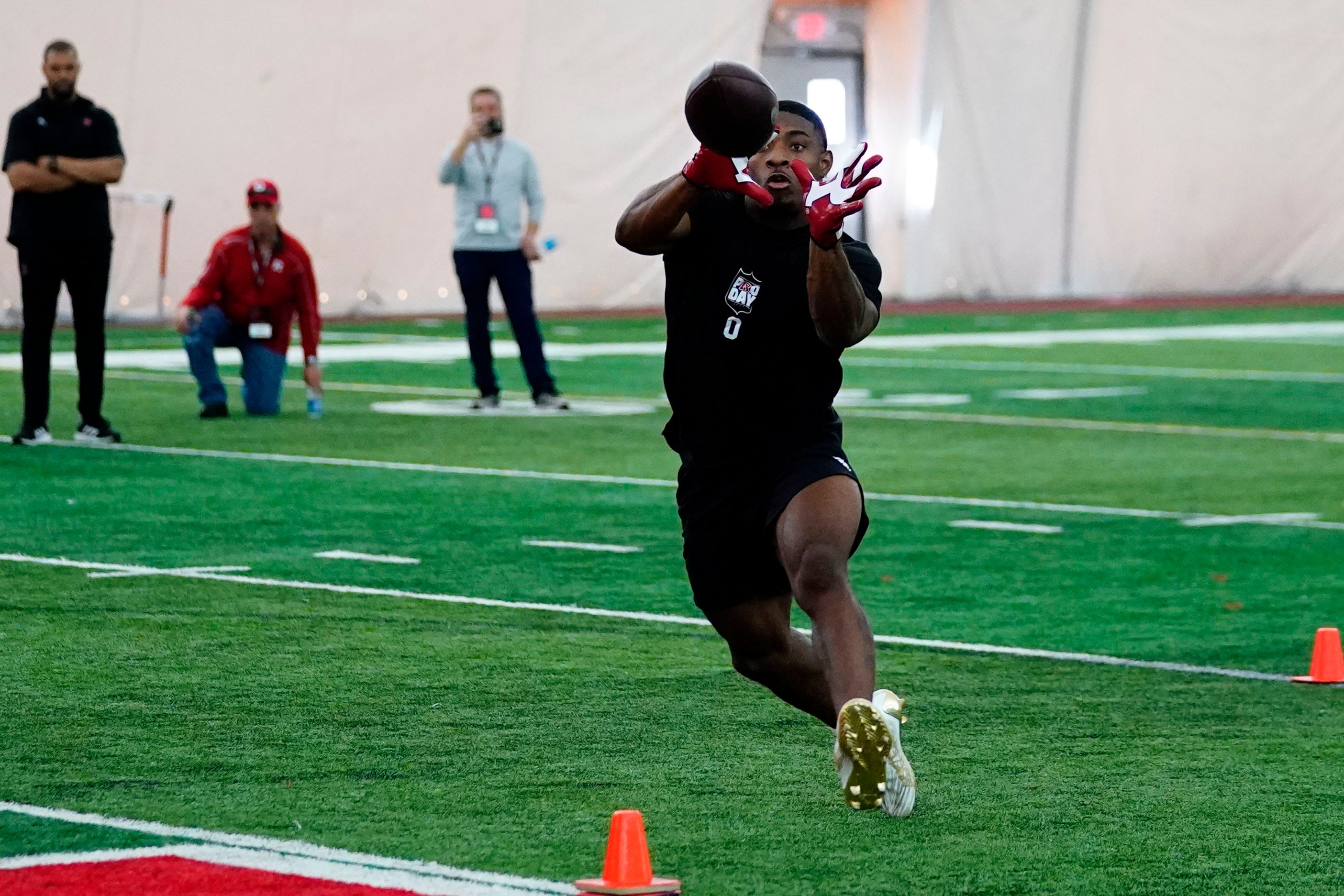 Rutgers' Christian Izien makes a catch during the Rutgers football pro day in Piscataway on Tuesday, March 21, 2023. Football Rutgers Football Pro Day