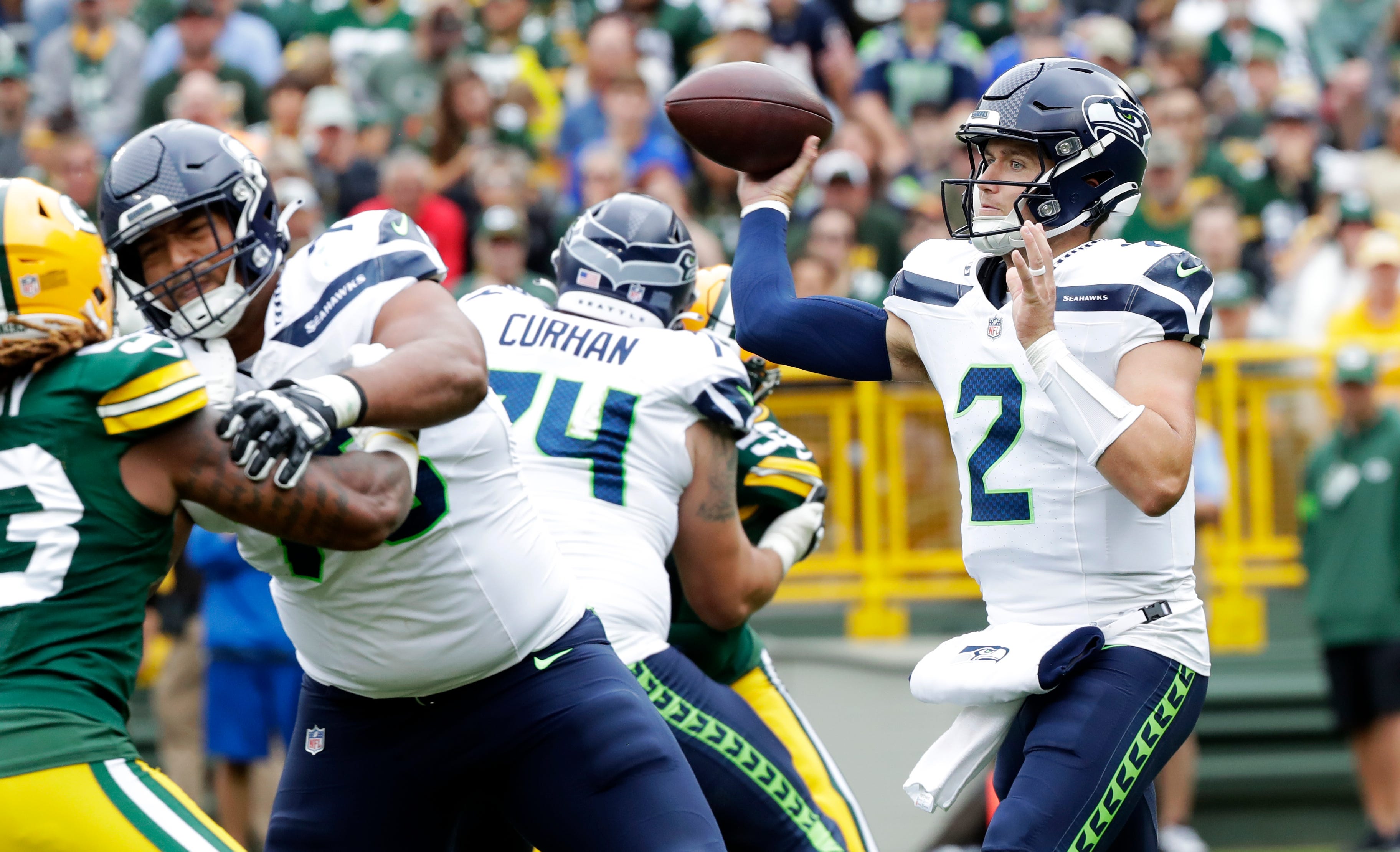 Seattle Seahawks quarterback Drew Lock (2) looks to pass during a preseason football game against the Green Bay Packers on Saturday, August 26, 2023, at Lambeau Field in Green Bay, Wis.