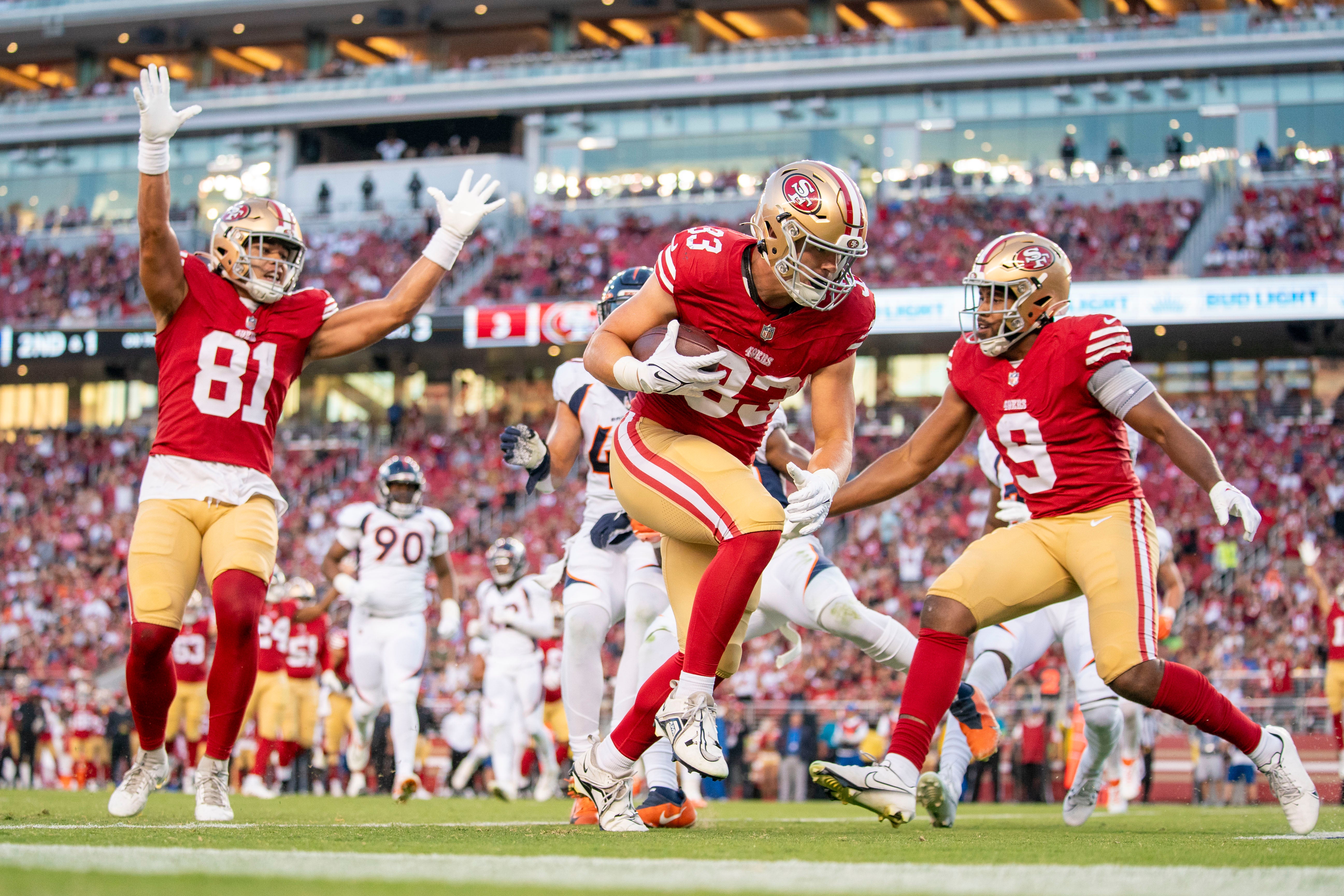 August 19, 2023; Santa Clara, California, USA; San Francisco 49ers fullback Jack Colletto (33) scores a touchdown against the Denver Broncos during the third quarter at Levi's Stadium. Mandatory Credit: Kyle Terada-USA TODAY Sports