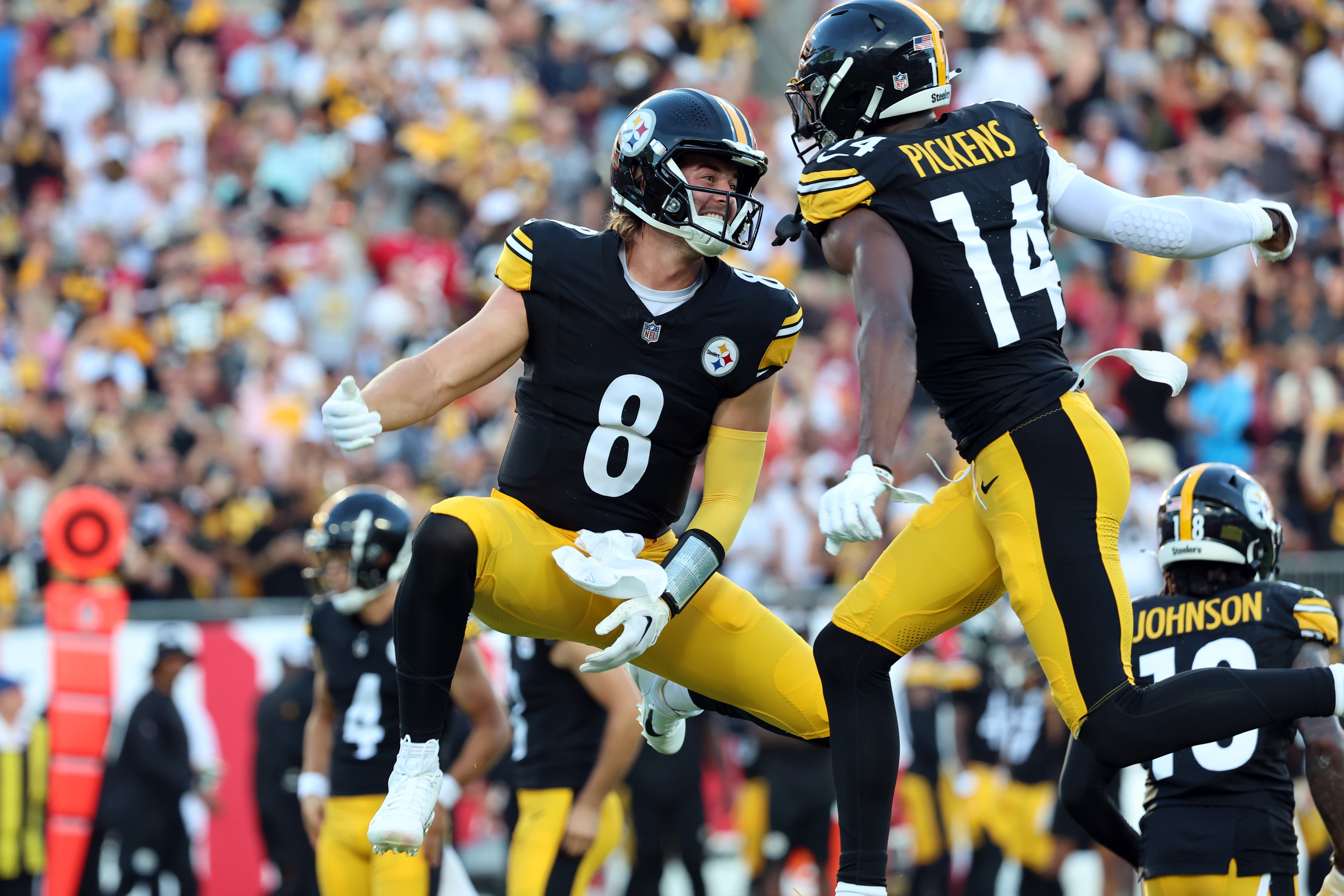 Aug 11, 2023; Tampa, Florida, USA; Pittsburgh Steelers wide receiver George Pickens (14) celebrates with quarterback Kenny Pickett (8) after scoring a touchdown against the Tampa Bay Buccaneers during the first quarter at Raymond James Stadium. Mandatory Credit: Kim Klement Neitzel-USA TODAY Sports