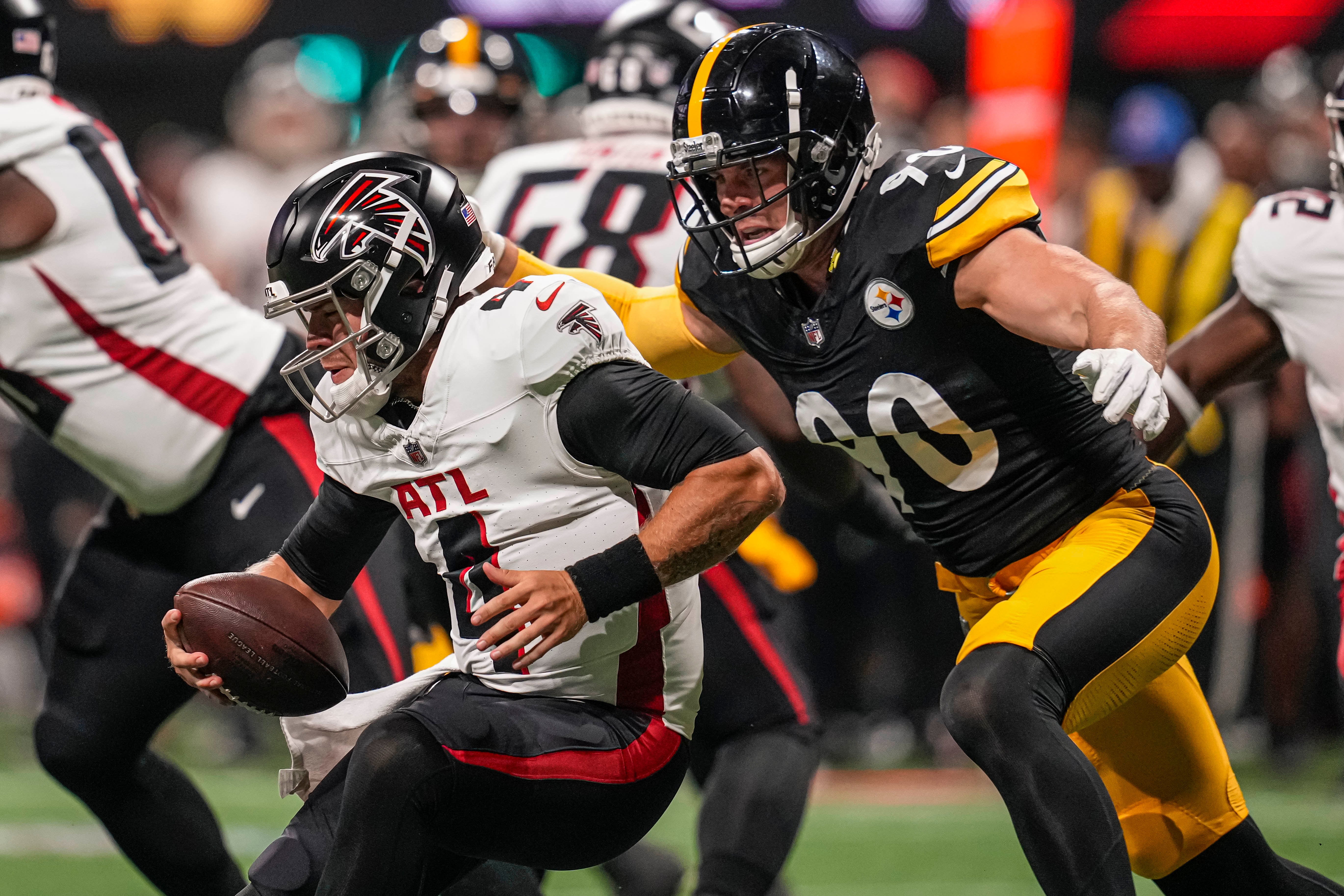 Aug 24, 2023; Atlanta, Georgia, USA; Pittsburgh Steelers linebacker T.J. Watt (90) sacks Atlanta Falcons quarterback Taylor Heinicke (4) during the first quarter at Mercedes-Benz Stadium. Mandatory Credit: Dale Zanine-USA TODAY Sports