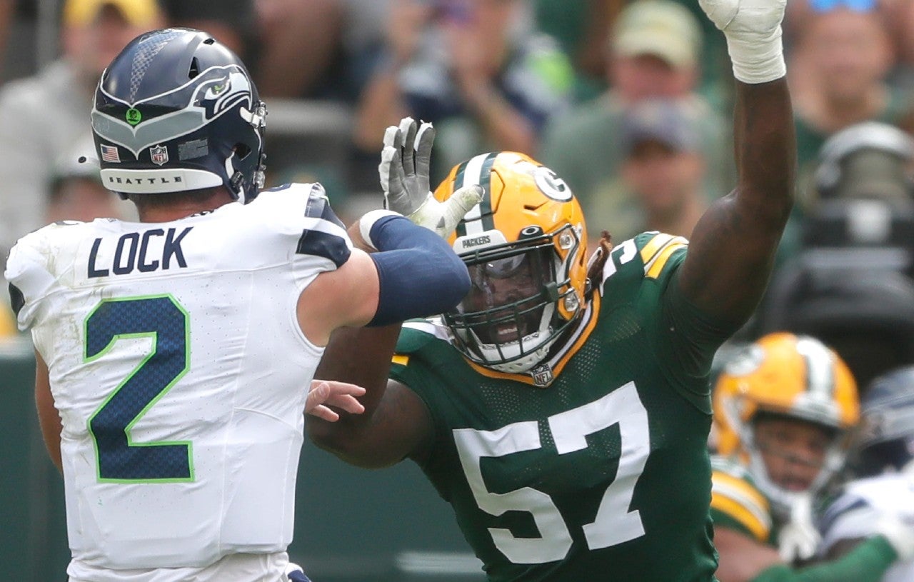 Green Bay Packers linebacker Brenton Cox Jr. (57) rushes Seattle Seahawks quarterback Drew Lock (2) during their preseason football game Saturday, August 26, 2023, at Lambeau Field in Green Bay, Wis. Green Bay defeated Seattle 19-15. Wm. Glasheen USA TODAY NETWORK-Wisconsin
