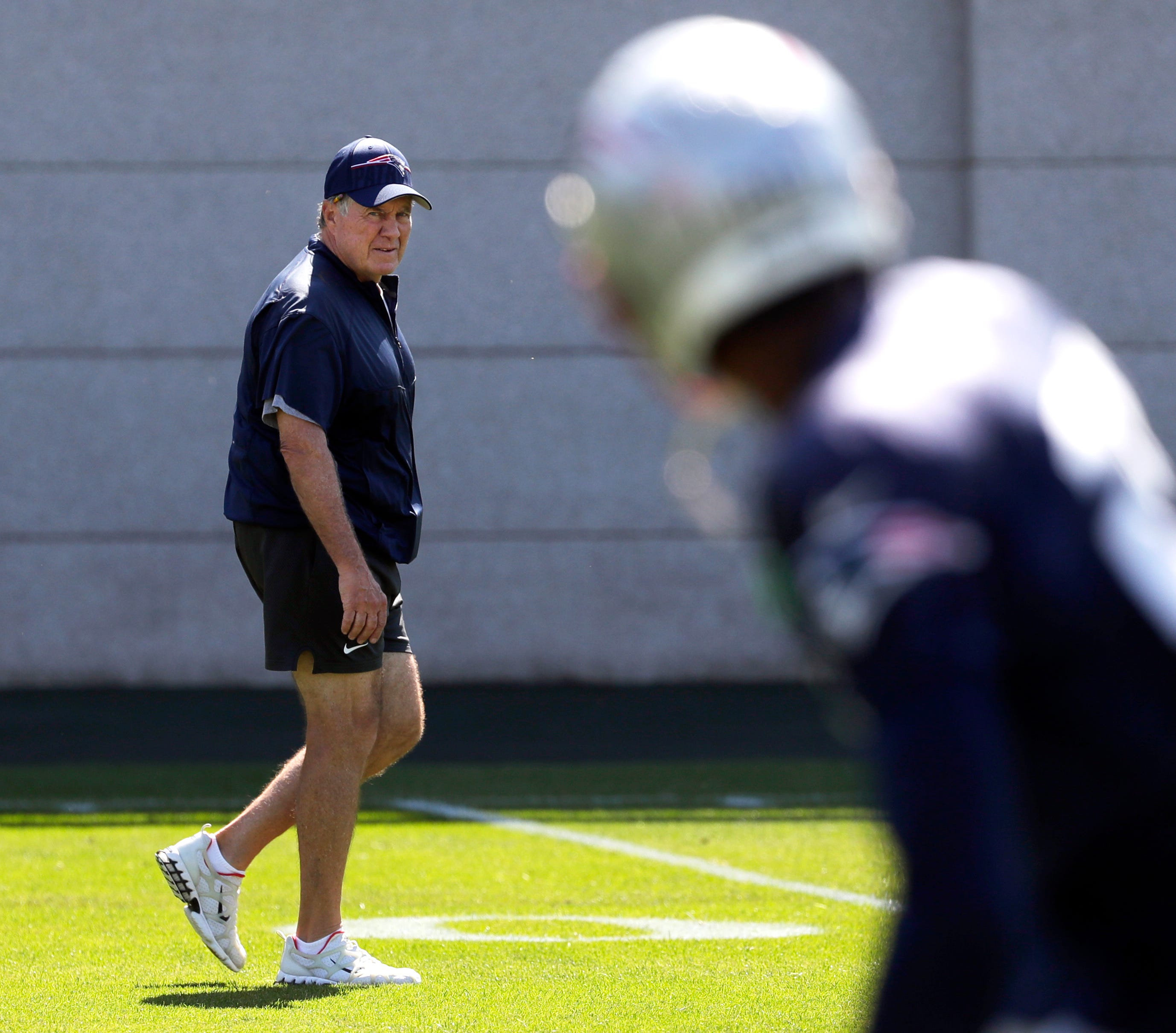 New England Patriots head coach Bill Belichick watches his players practicing on during a joint practice with the Green Bay Packers on Aug. 16, 2023, in Ashwaubenon, Wis.