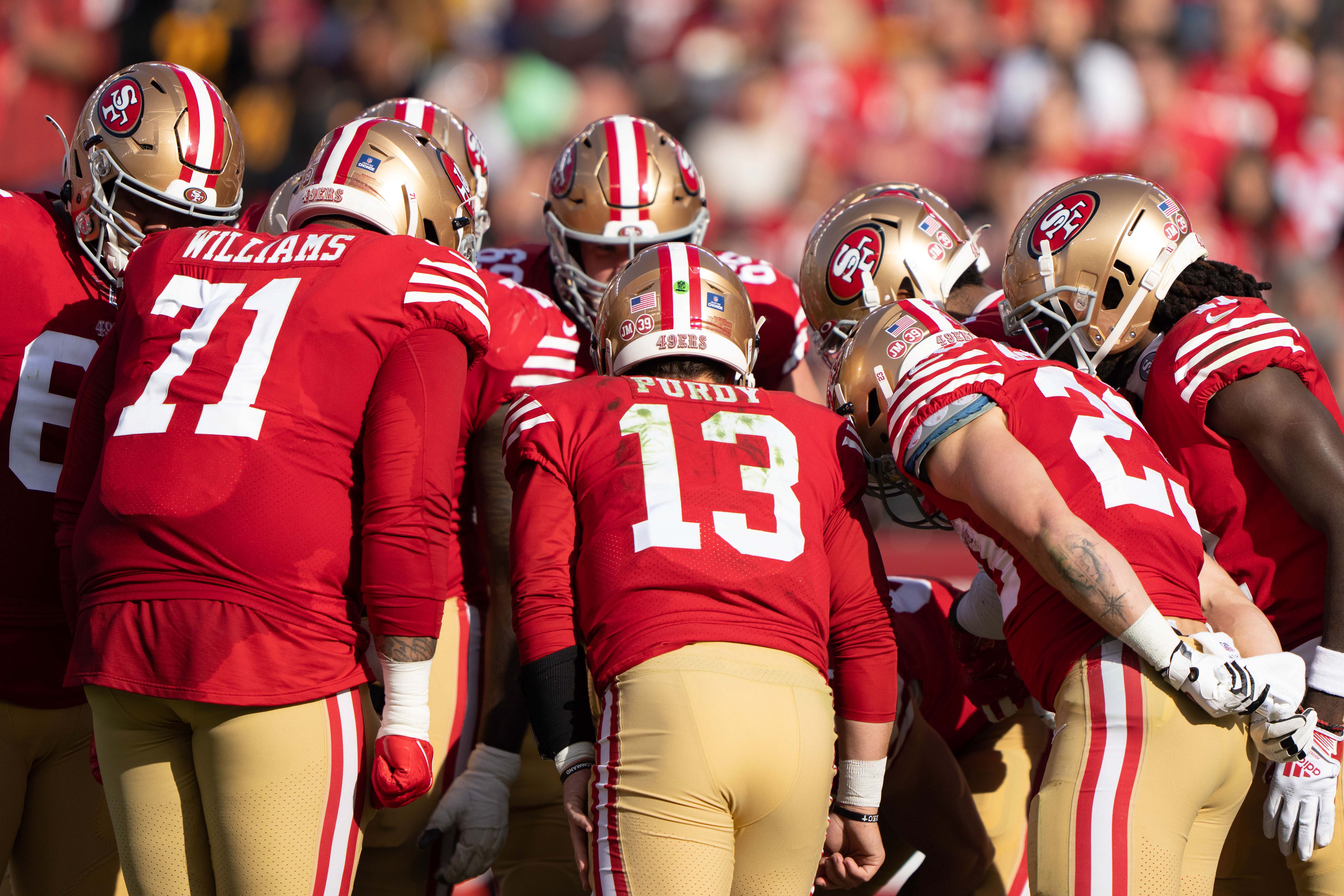 Dec 24, 2022; Santa Clara, California, USA; San Francisco 49ers quarterback Brock Purdy (13) calls a play in the huddle during the second quarter against the Washington Commanders at Levi's Stadium. Mandatory Credit: Stan Szeto-USA TODAY Sports