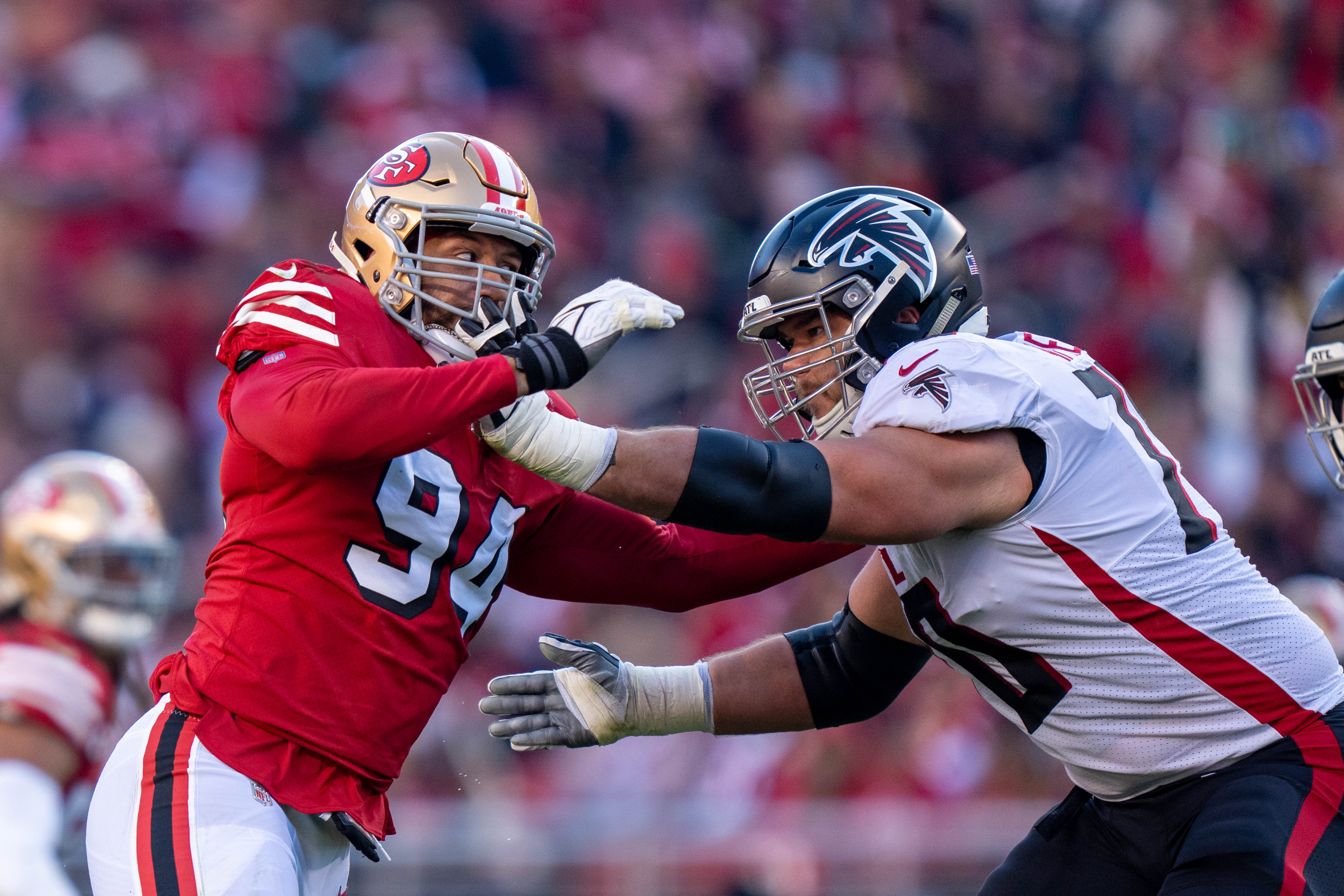 December 19, 2021; Santa Clara, California, USA; San Francisco 49ers defensive end Jordan Willis (94) and Atlanta Falcons offensive tackle Jake Matthews (70) during the third quarter at Levi's Stadium. Mandatory Credit: Kyle Terada-USA TODAY Sports