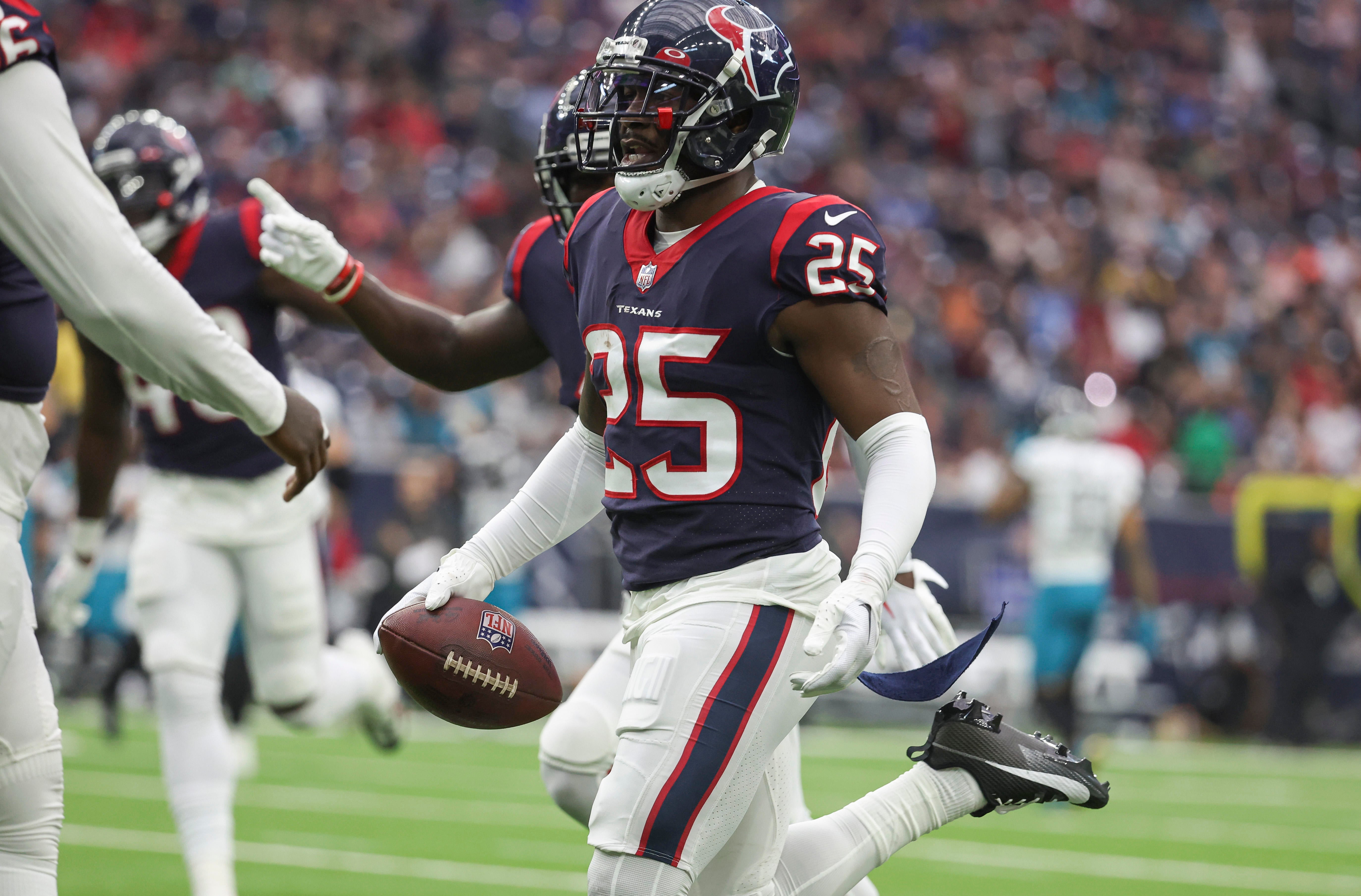 Jan 1, 2023; Houston, Texas, USA; Houston Texans cornerback Desmond King II (25) runs with the ball after a Texans interception during the second quarter against the Jacksonville Jaguars at NRG Stadium. Mandatory Credit: Troy Taormina-USA TODAY Sports