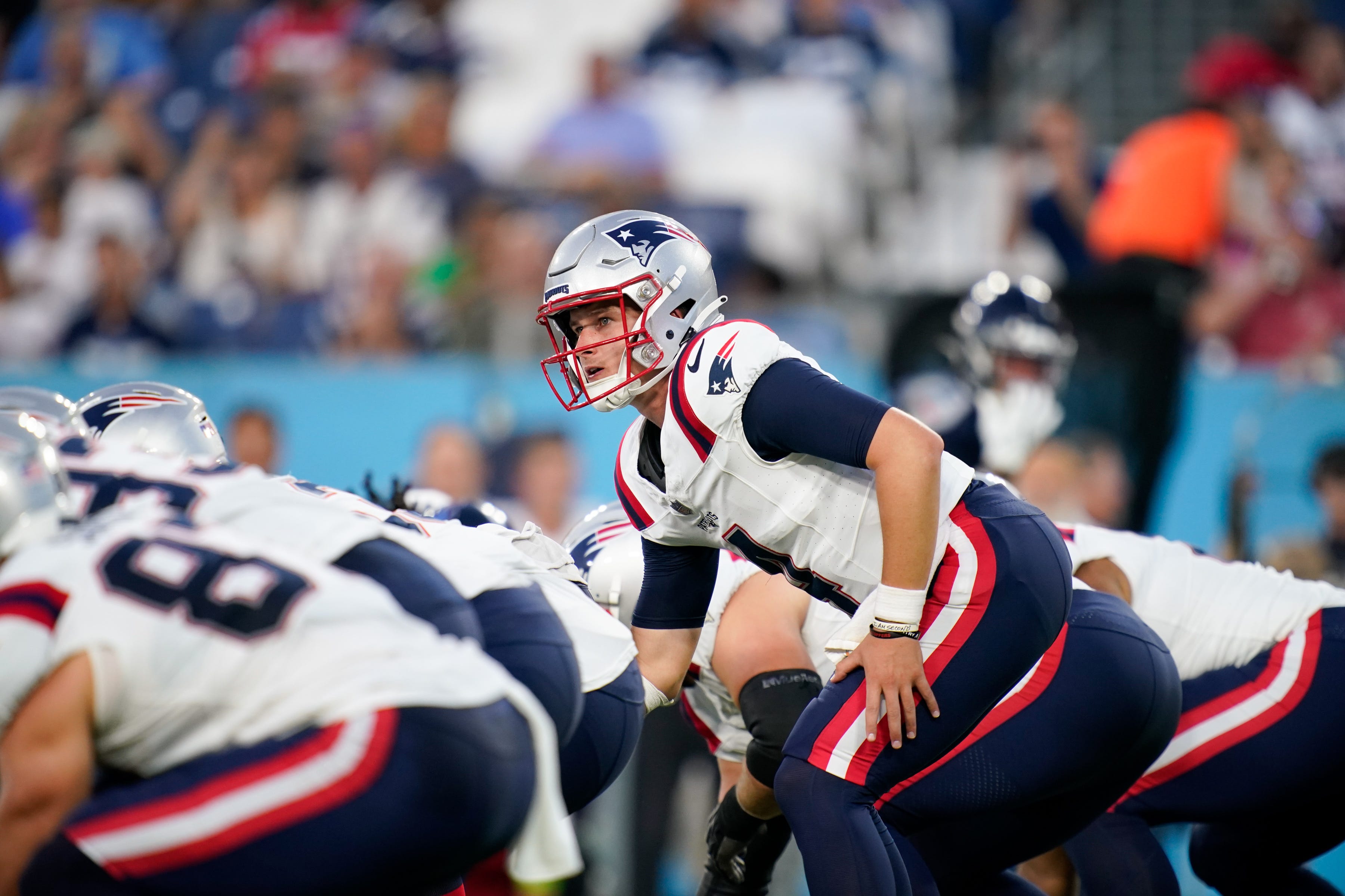 New England Patriots quarterback Bailey Zappe (4) leads his team against the Tennessee Titans during the first quarter at Nissan Stadium in Nashville, Tenn., Friday, Aug. 25, 2023