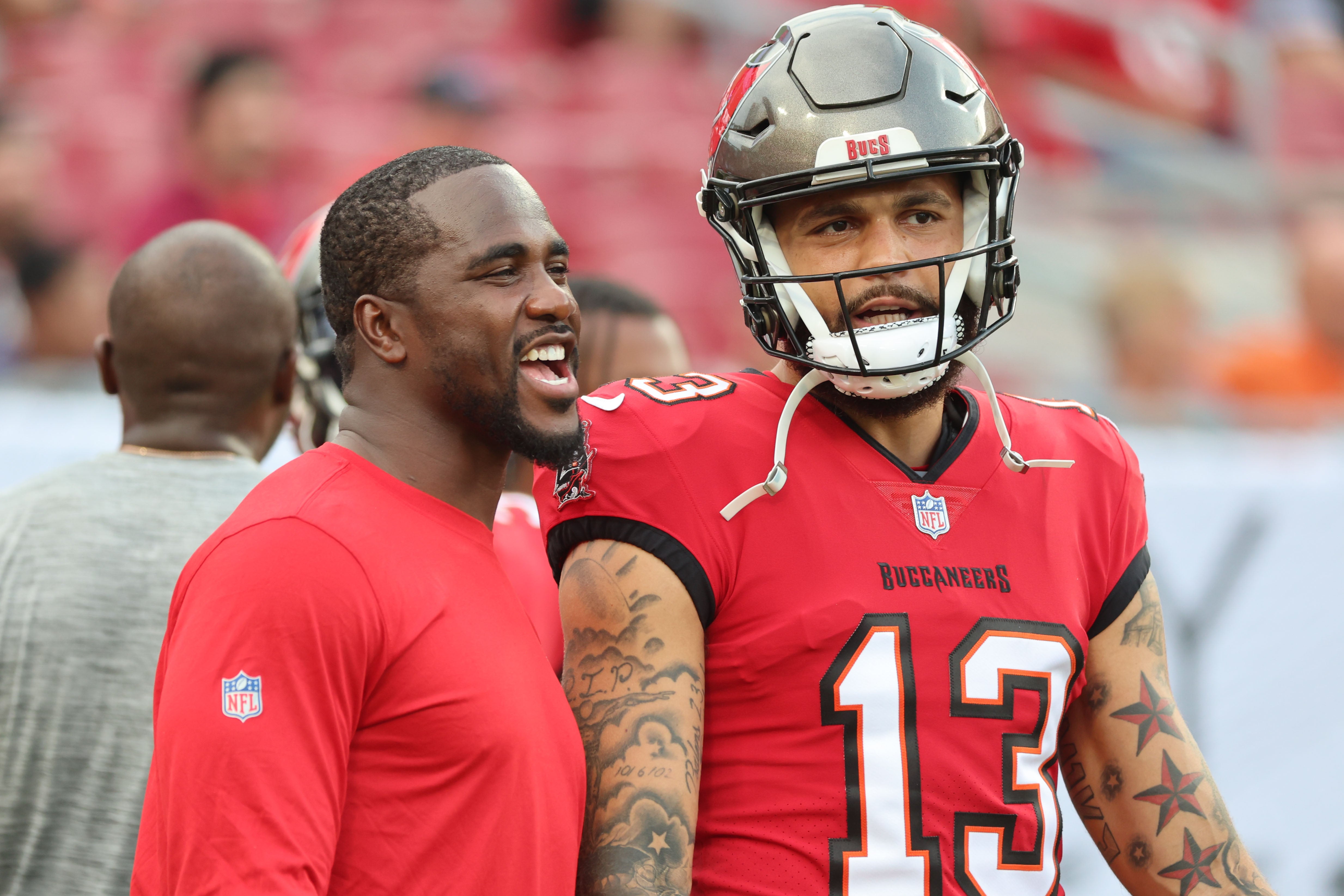 Aug 26, 2023; Tampa, Florida, USA; Tampa Bay Buccaneers linebacker Lavonte David (54) and wide receiver Mike Evans (13) against the Baltimore Ravens prior to the game at Raymond James Stadium. Mandatory Credit: Kim Klement Neitzel-USA TODAY Sports