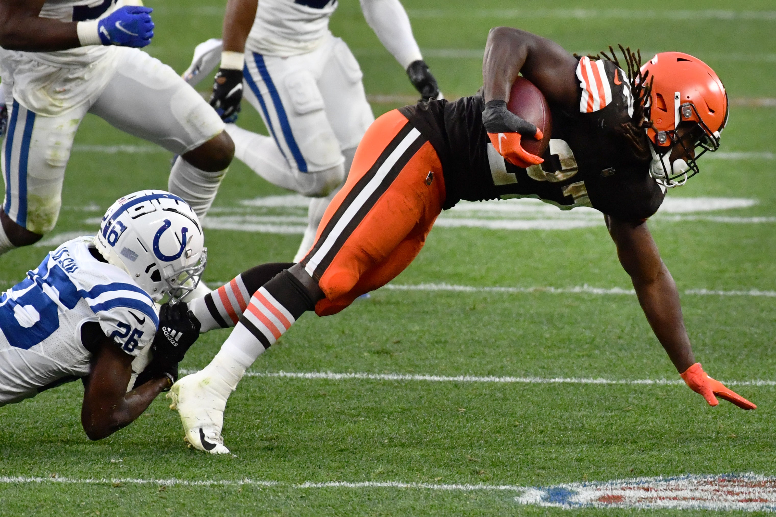 Oct 11, 2020; Cleveland, Ohio, USA; Indianapolis Colts cornerback Rock Ya-Sin (26) tackles Cleveland Browns running back Kareem Hunt (27) during the second half at FirstEnergy Stadium.