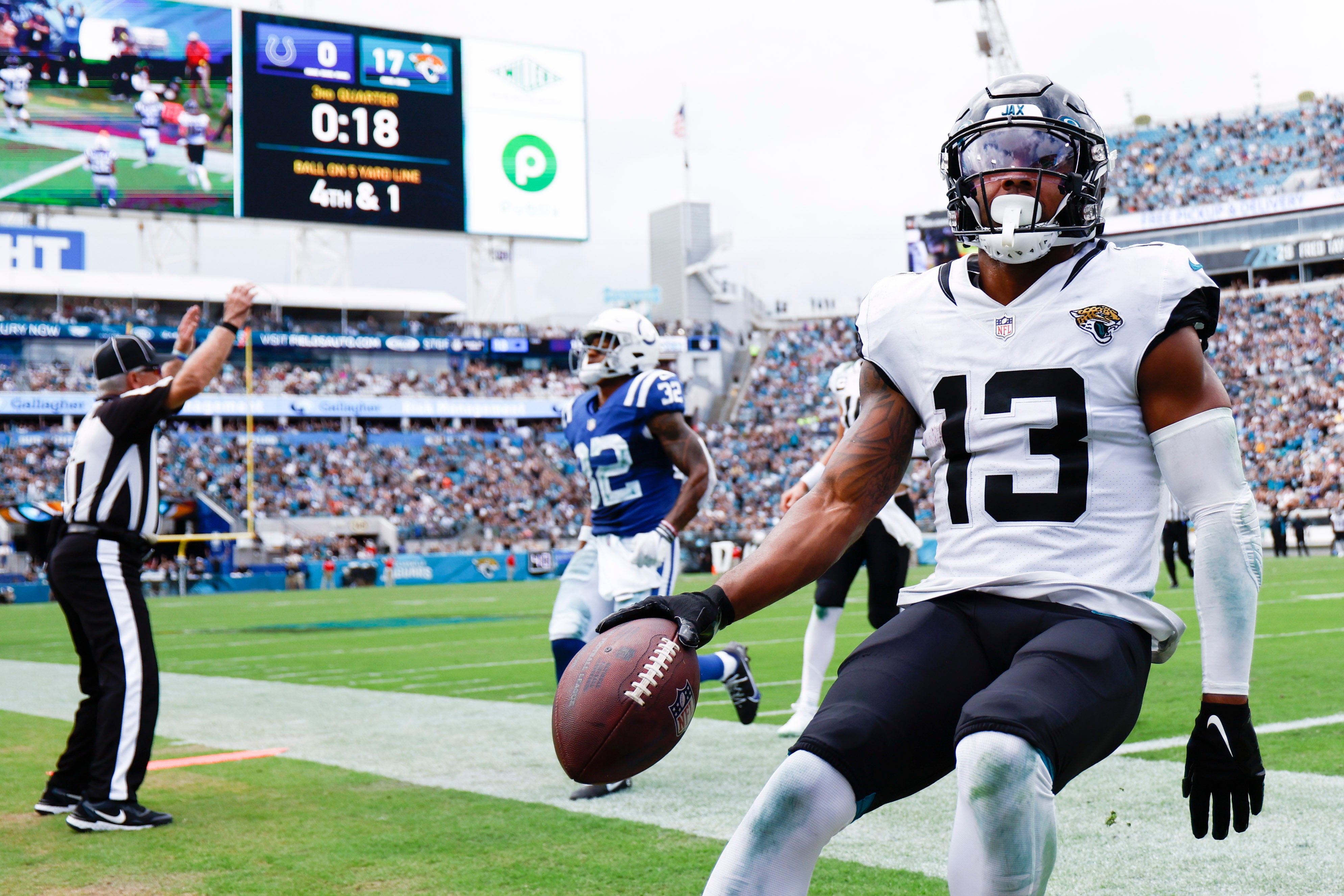 Sep 18, 2022; Jacksonville, Florida, USA; Jacksonville Jaguars wide receiver Christian Kirk (13) reacts after scoring a touchdown against the Indianapolis Colts during the third quarter at TIAA Bank Field.