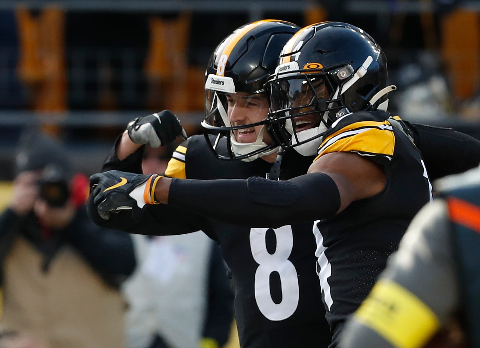 Jan 8, 2023; Pittsburgh, Pennsylvania, USA; Pittsburgh Steelers quarterback Kenny Pickett (8) and wide receiver George Pickens (14) celebrate after combining for a touchdown against the Cleveland Browns during the second quarter at Acrisure Stadium. Charles LeClaire-USA TODAY Sports