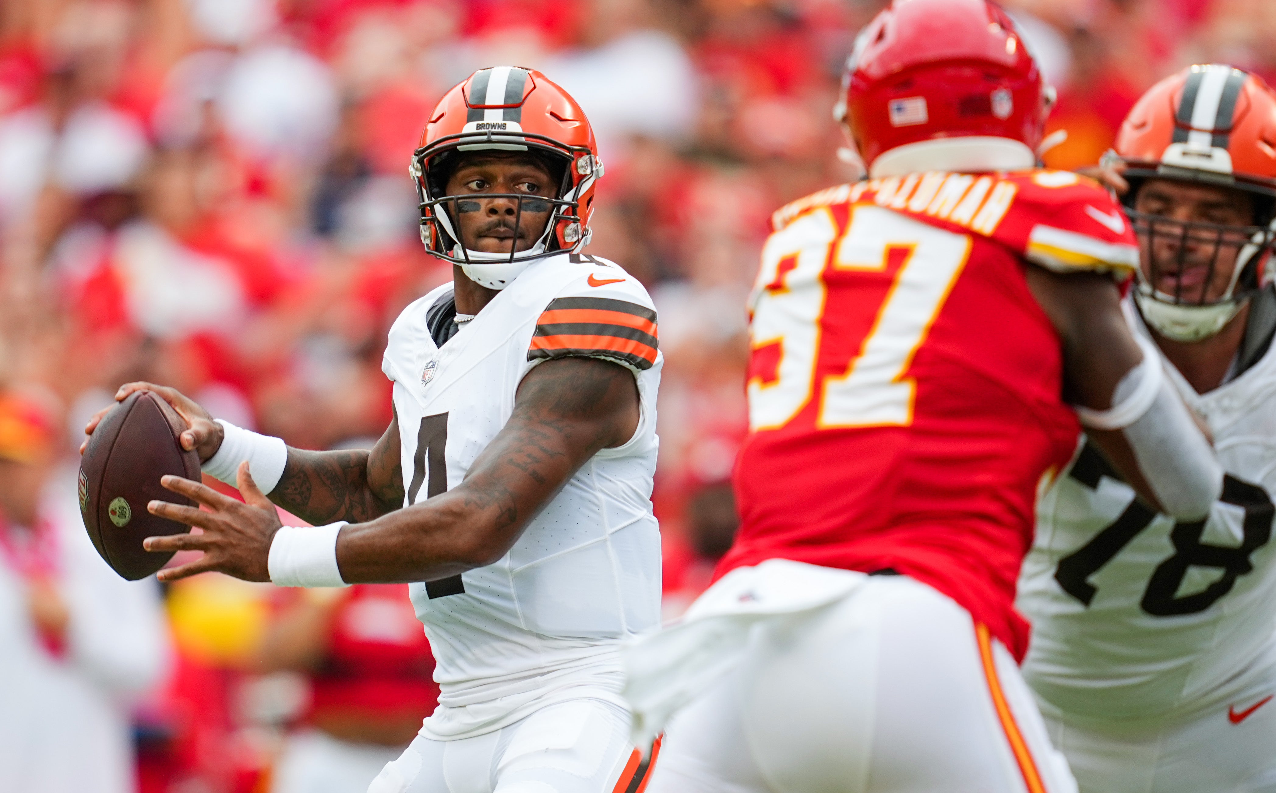 Aug 26, 2023; Kansas City, Missouri, USA; Cleveland Browns quarterback Deshaun Watson (4) throws a pass against Kansas City Chiefs defensive end Felix Anudike-Uzomah (97) during the first half at GEHA Field at Arrowhead Stadium. Mandatory Credit: Jay Biggerstaff-USA TODAY Sports