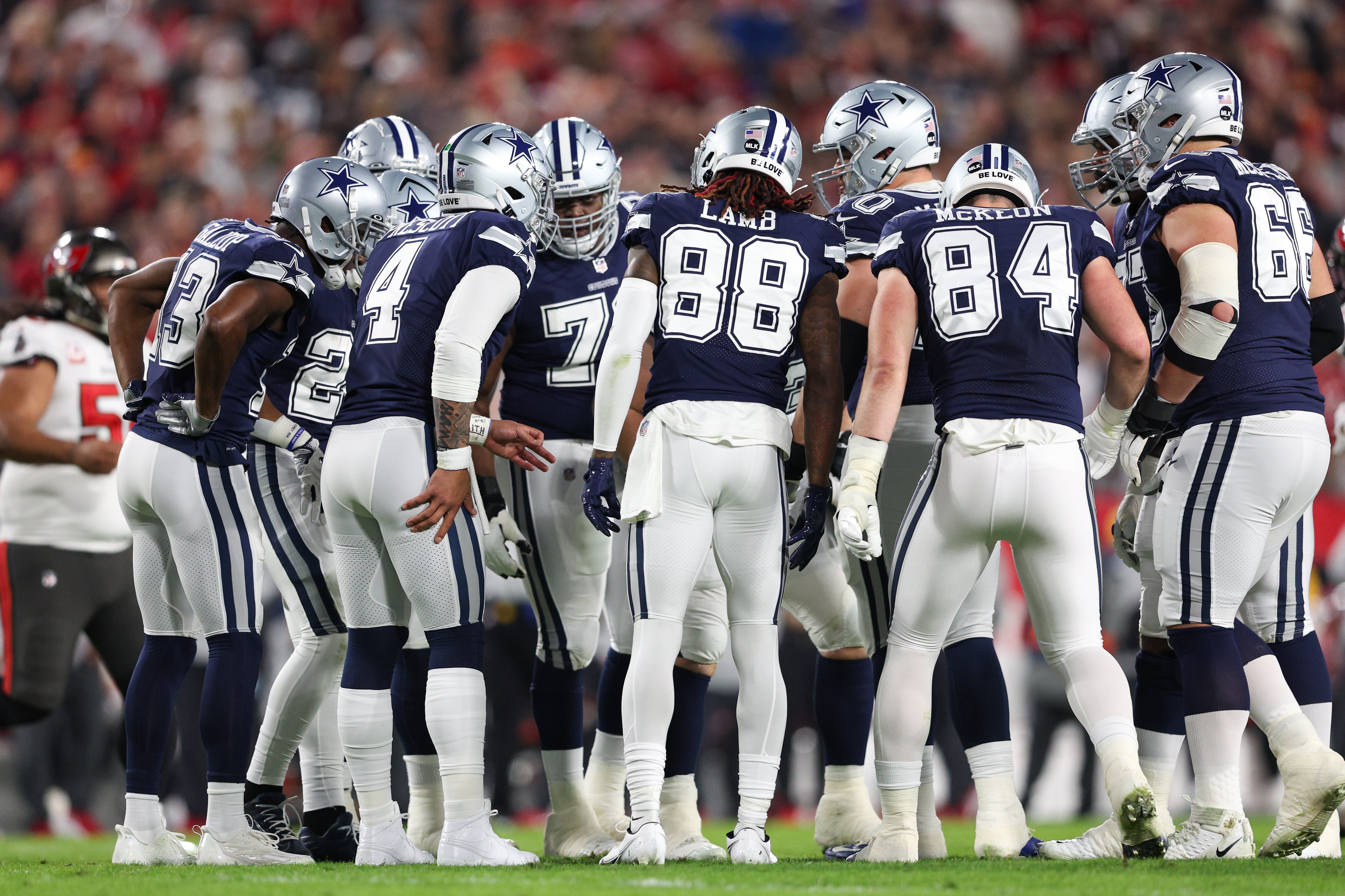 Dallas Cowboys quarterback Dak Prescott (4) leads a huddle against the Tampa Bay Buccaneers in the first quarter during a wild card game at Raymond James Stadium. Mandatory Credit: Nathan Ray Seebeck-USA TODAY Sports