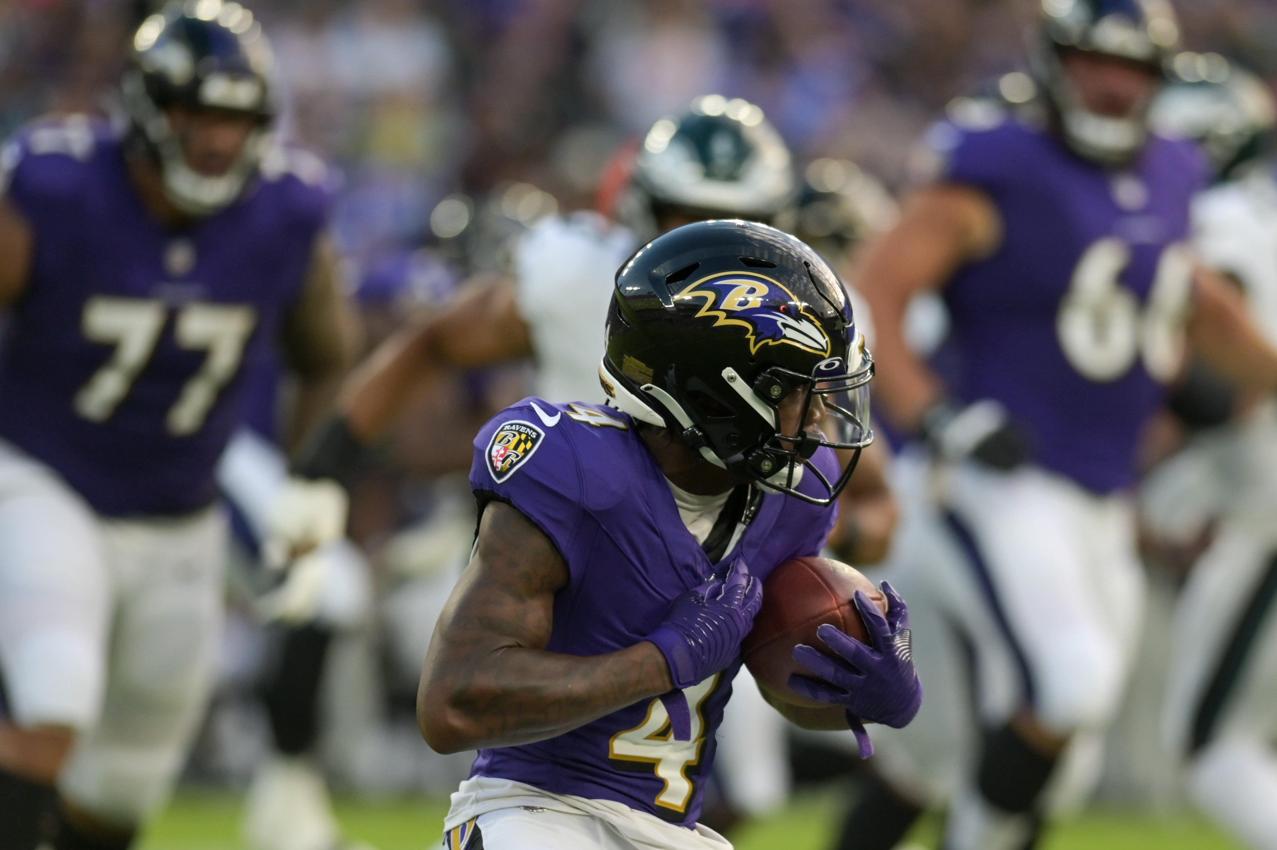 Aug 12, 2023; Baltimore, Maryland, USA; Baltimore Ravens wide receiver Zay Flowers (4) runs with the ball after a catch during the first half against the Philadelphia Eagles at M&T Bank Stadium. Mandatory Credit: Tommy Gilligan-USA TODAY Sports
