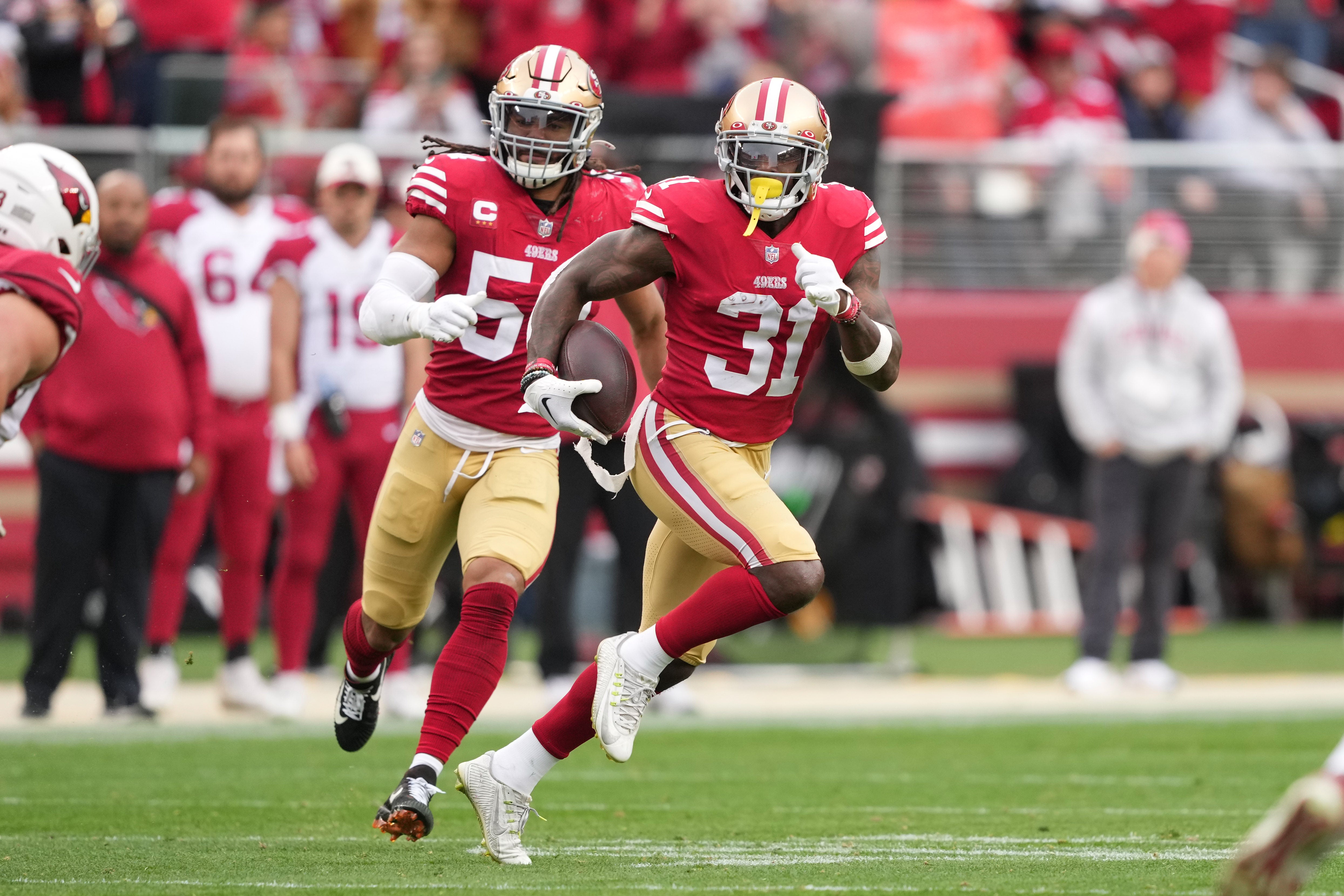 Jan 8, 2023; Santa Clara, California, USA; San Francisco 49ers safety Tashaun Gipson Sr. (31) returns an interception against the Arizona Cardinals during the third quarter at Levi's Stadium. Mandatory Credit: Darren Yamashita-USA TODAY Sports