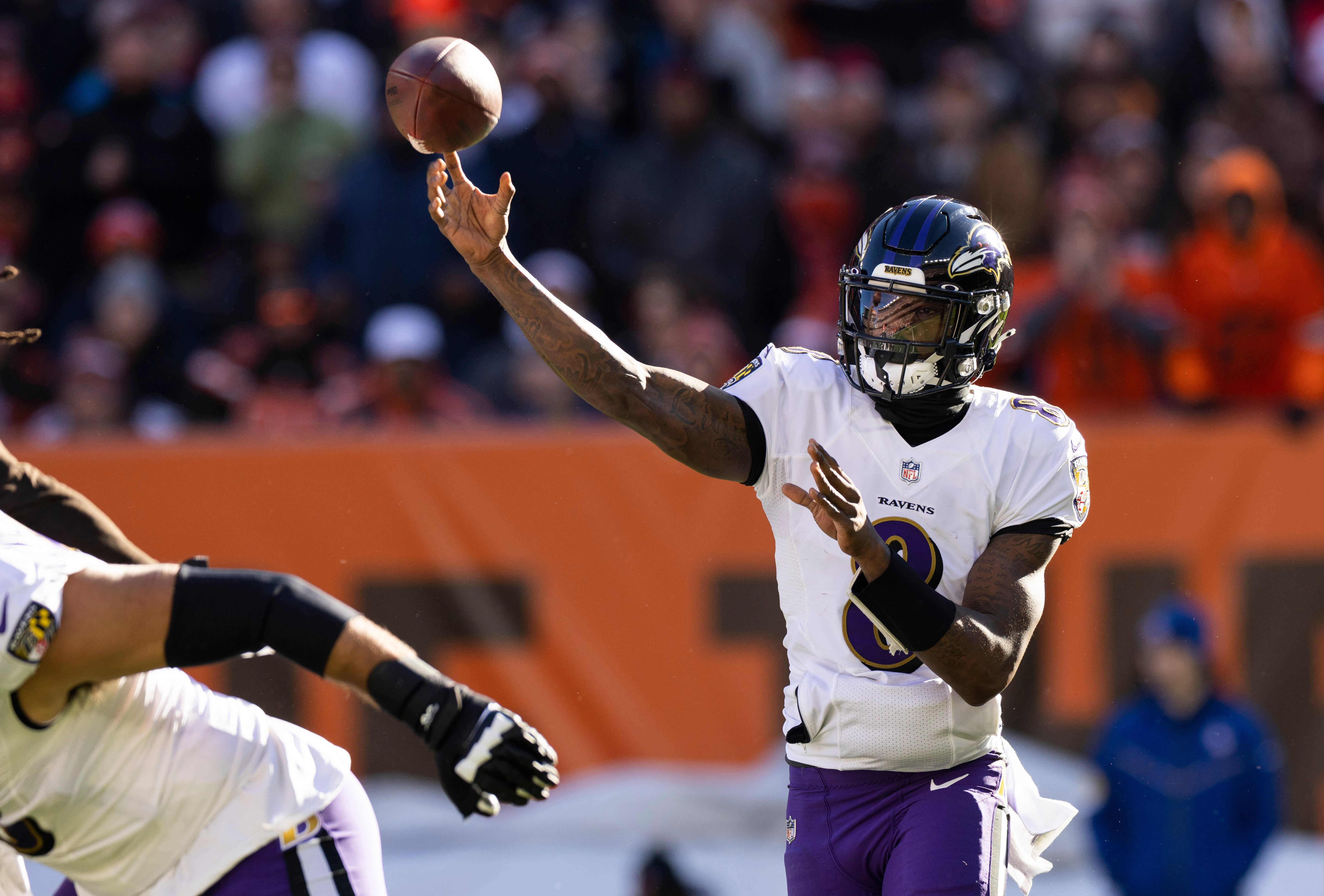 Dec 12, 2021; Cleveland, Ohio, USA; Baltimore Ravens quarterback Lamar Jackson (8) throws the ball against the Cleveland Browns during the first quarter at FirstEnergy Stadium. Mandatory Credit: Scott Galvin-USA TODAY Sports