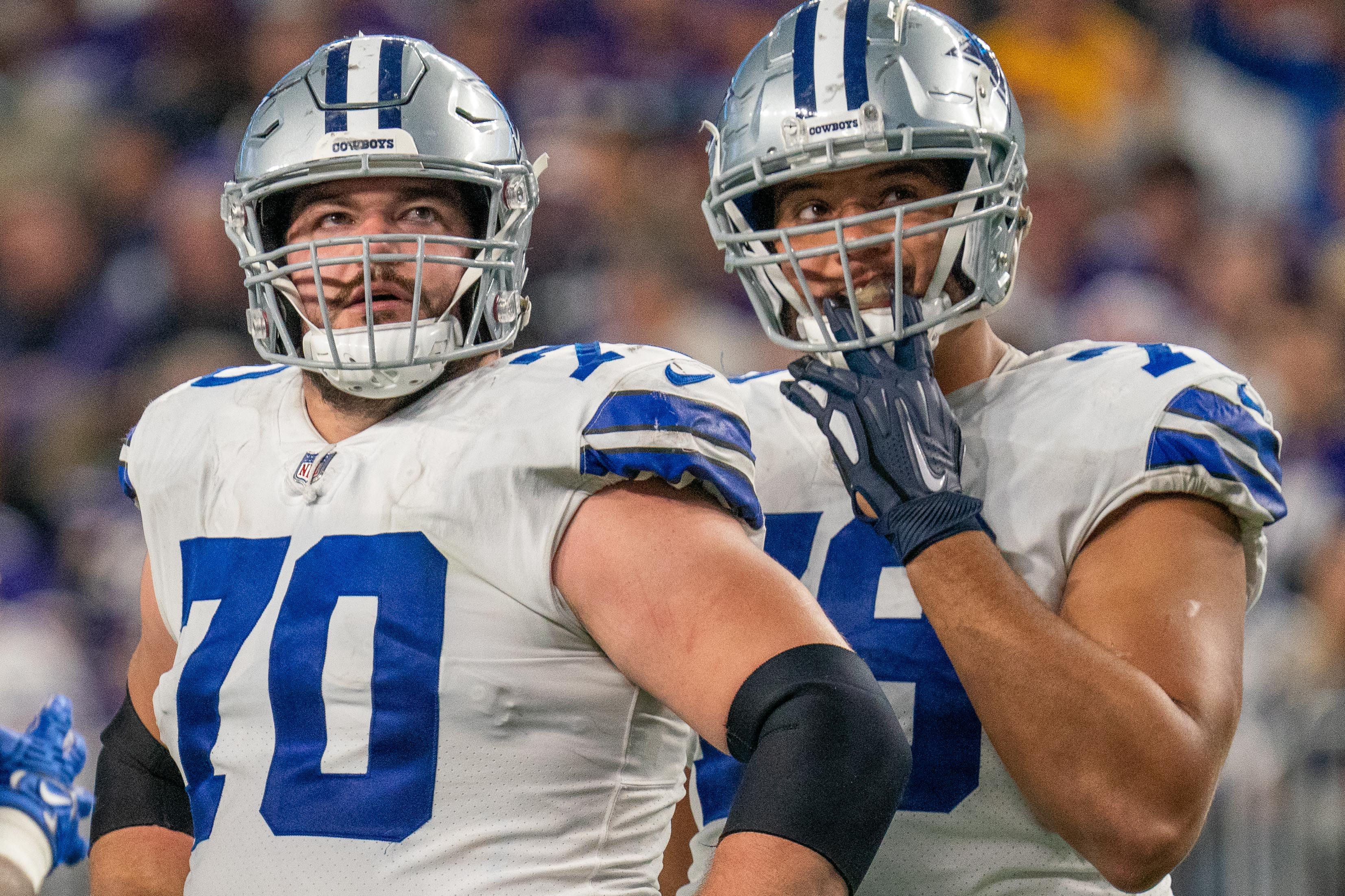 Dallas Cowboys guard Zack Martin (70) and Dallas Cowboys offensive tackle Terence Steele (78) look at a replay late in the game against the Minnesota Vikings at U.S. Bank Stadium. Mandatory Credit: Matt Blewett-USA TODAY Sports