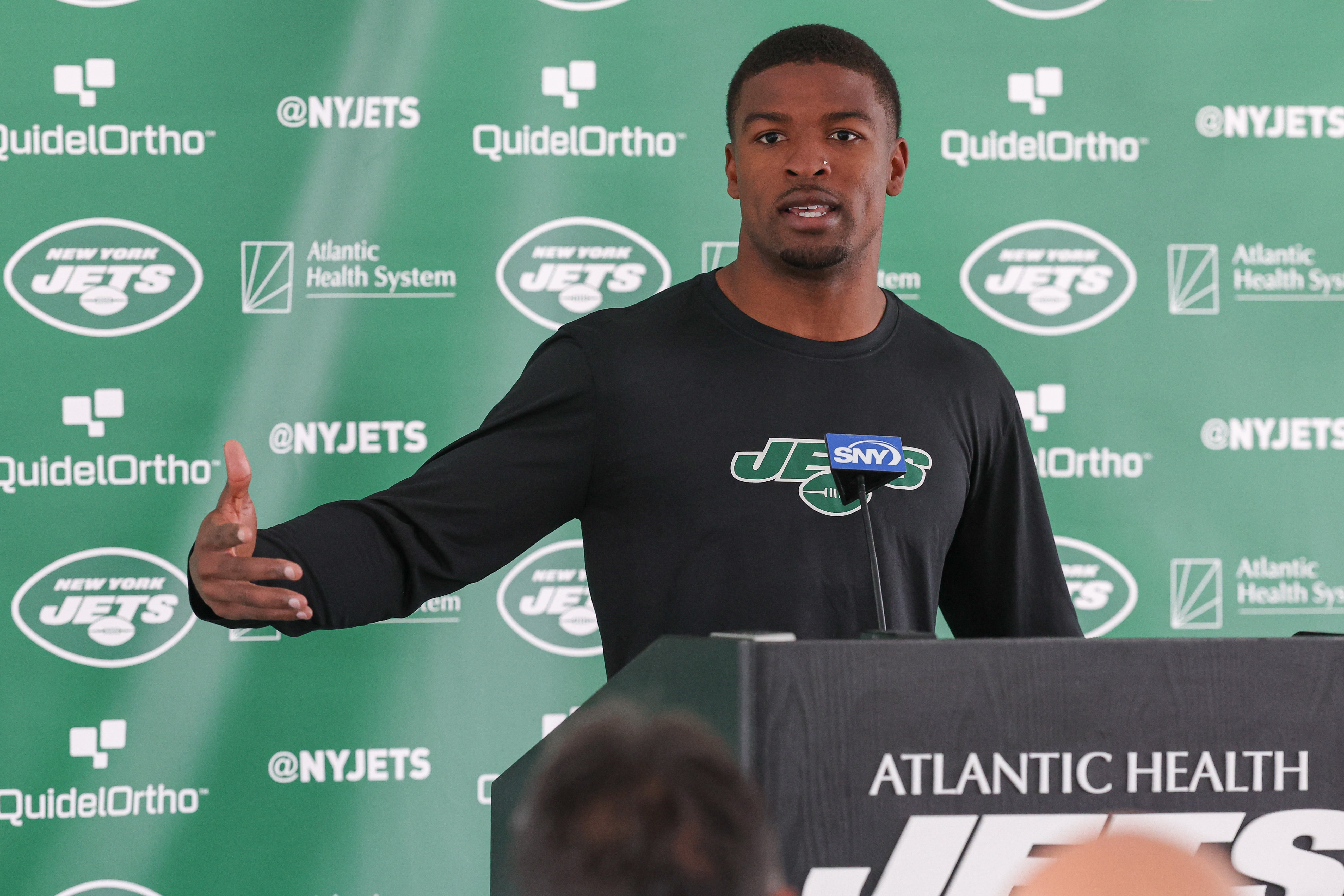 New York Jets cornerback D.J. Reed (4) talks with media during the New York Jets Training Camp at Atlantic Health Jets Training Center. Mandatory Credit: Vincent Carchietta-USA TODAY Sports