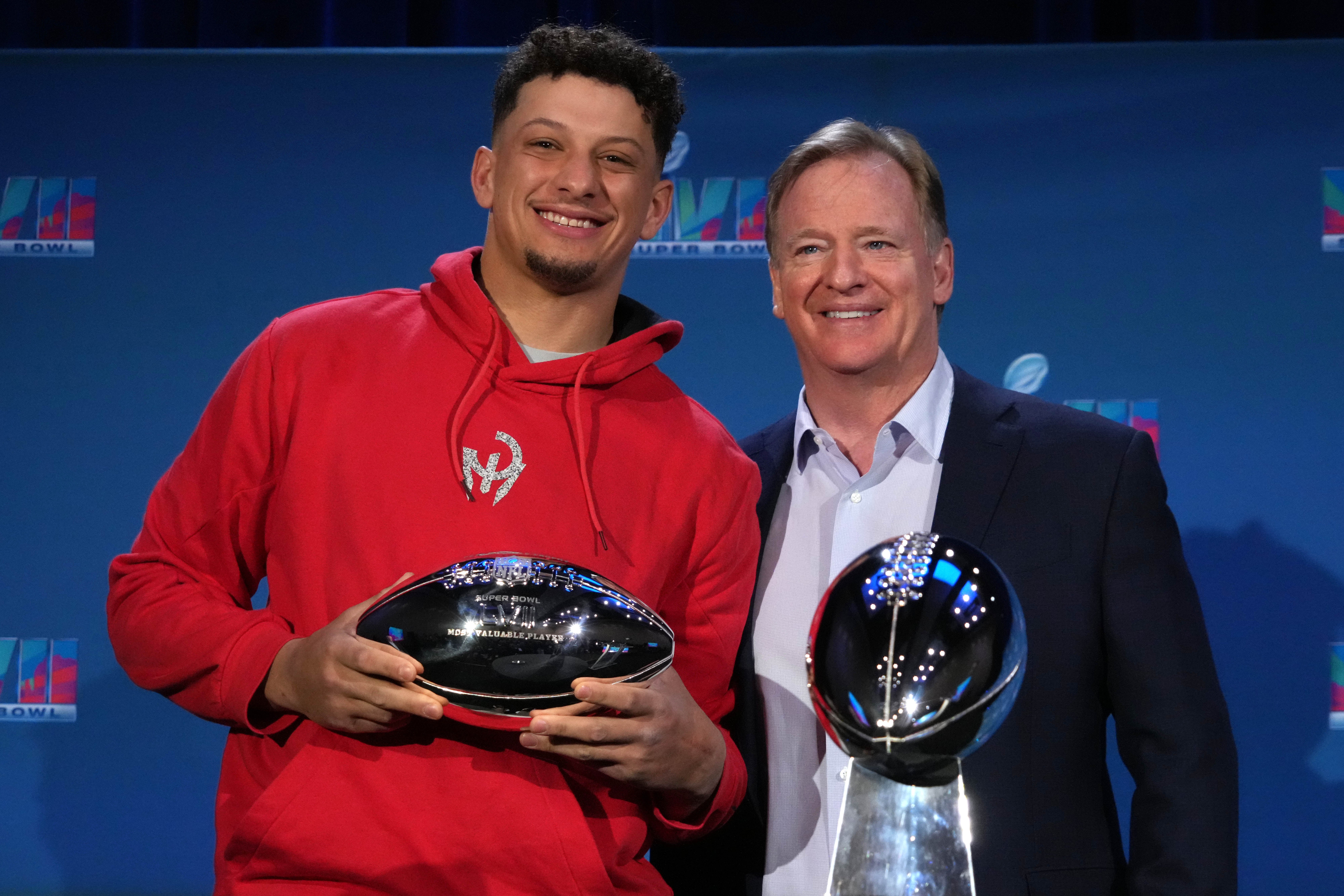Feb 13, 2023; Phoenix, AZ, USA; Kansas City Chiefs quarterback Patrick Mahomes (left) and NFL commissioner Roger Goodell pose with Vince Lombardi and most valuable player trophies during the Super Bowl 57 Winning Team Head Coach and MVP press conference at the Phoenix Convention Center.