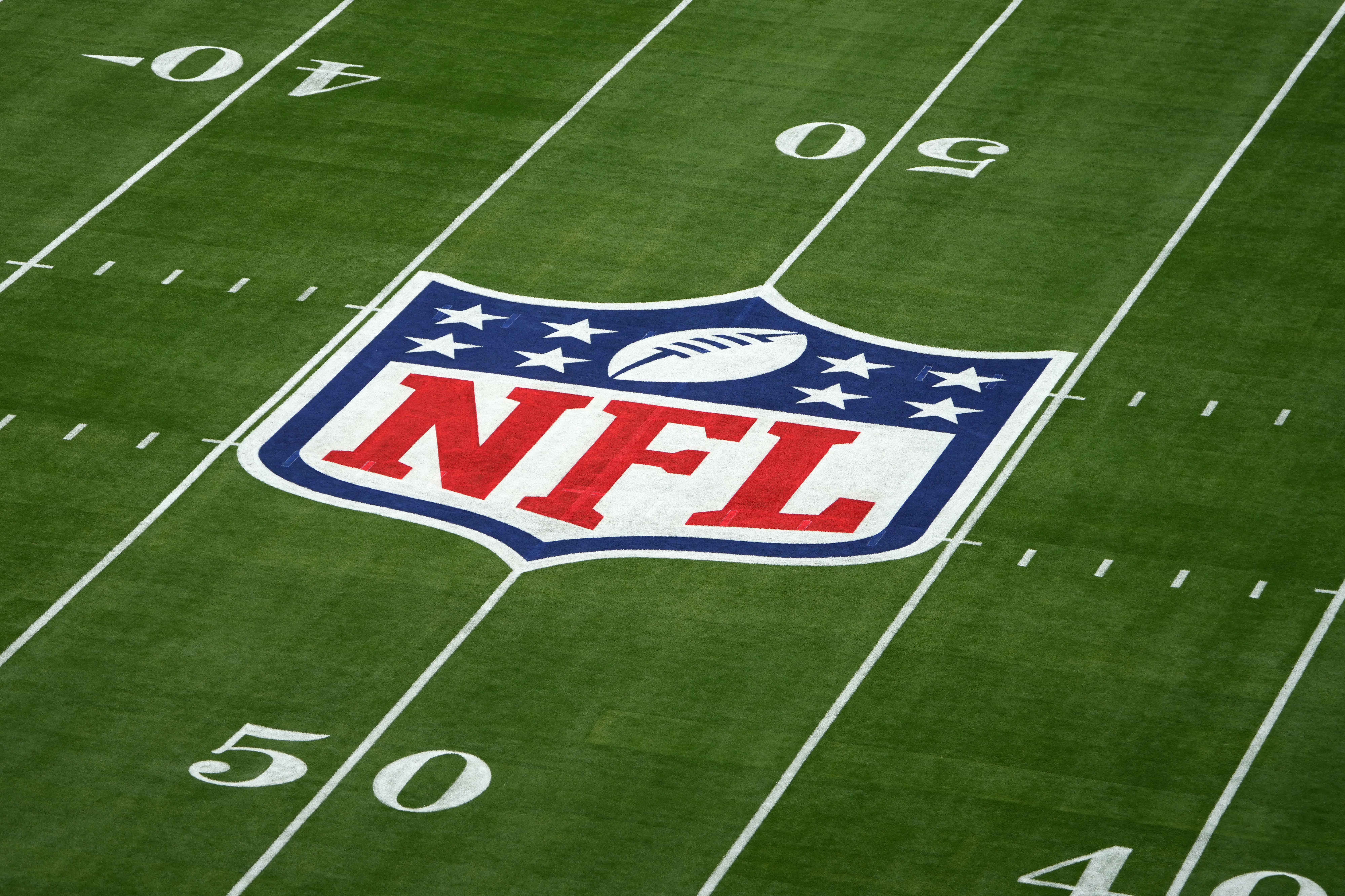 Feb 12, 2023; Glendale, Arizona, USA; A NFL shield logo at midfield of Super Bowl 57 at State Farm Stadium.