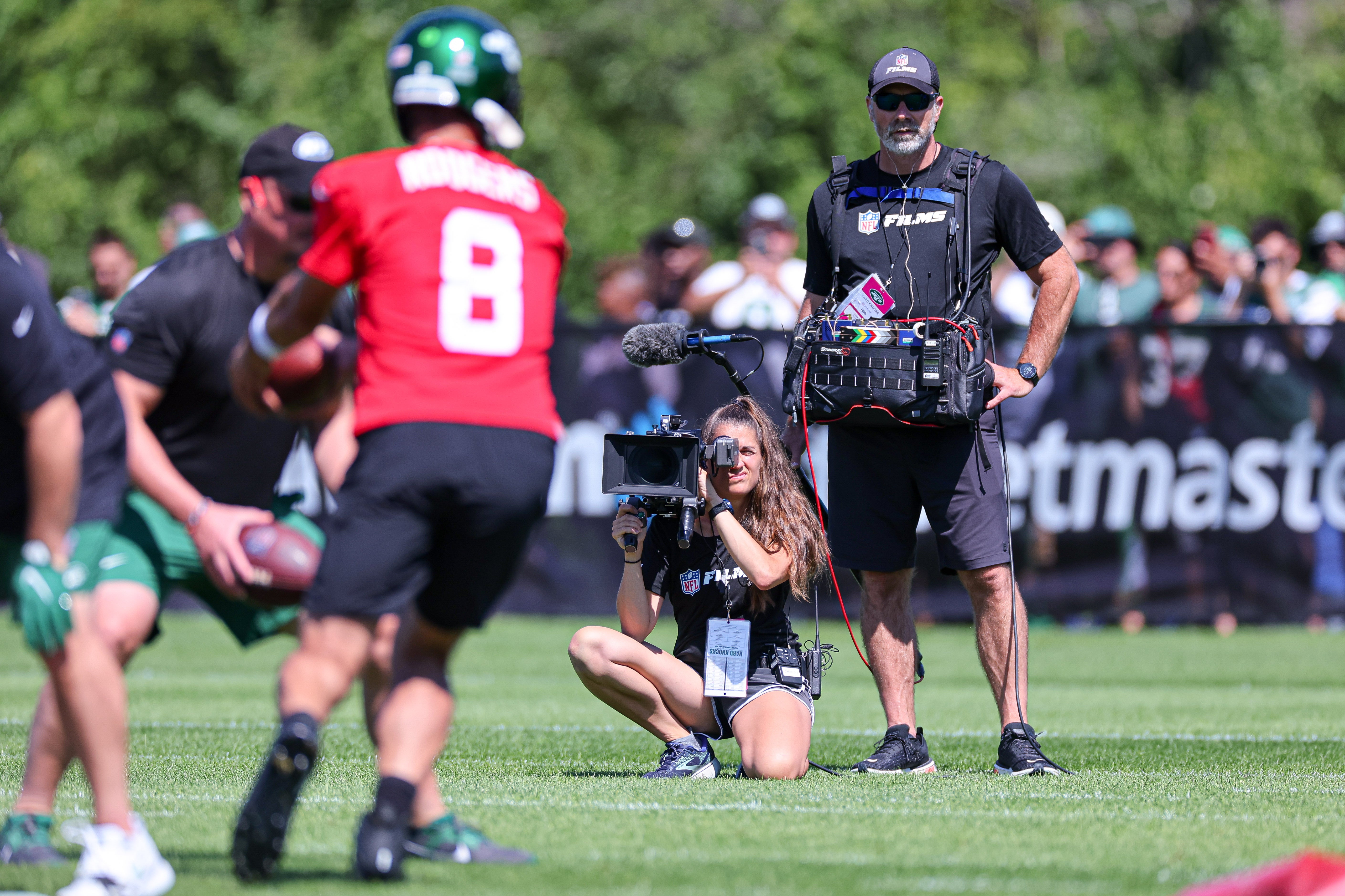An NFL Films crew for the HBO television series Hard Knocks films as New York Jets quarterback Aaron Rodgers (8) participates in drills during the New York Jets Training Camp at Atlantic Health Jets Training Center. Mandatory Credit: Vincent Carchietta-USA TODAY Sports