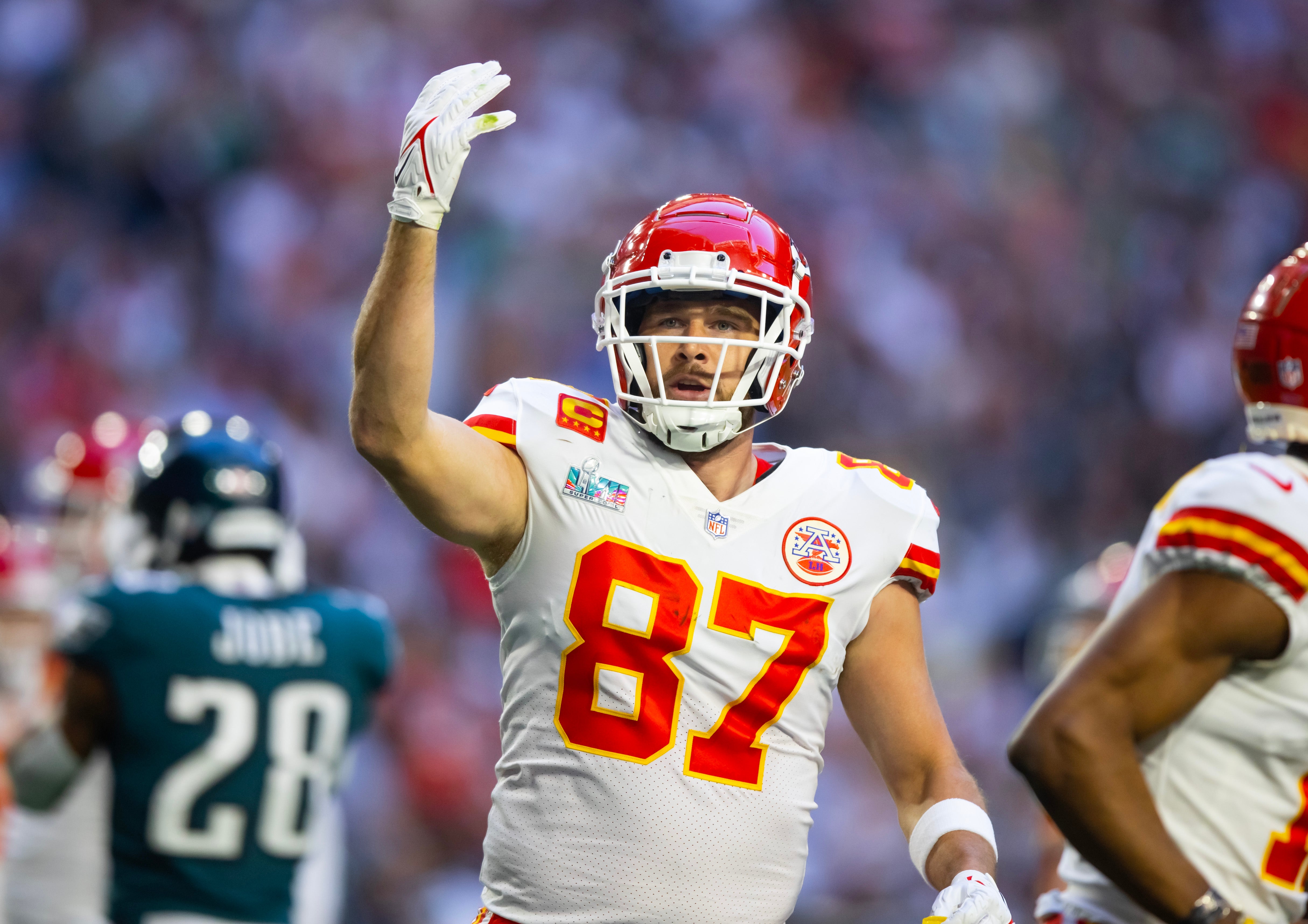Feb 12, 2023; Glendale, Arizona, US; Kansas City Chiefs tight end Travis Kelce (87) celebrates a touchdown against the Philadelphia Eagles during the first quarter of Super Bowl LVII at State Farm Stadium. Mark J. Rebilas-USA TODAY Sports