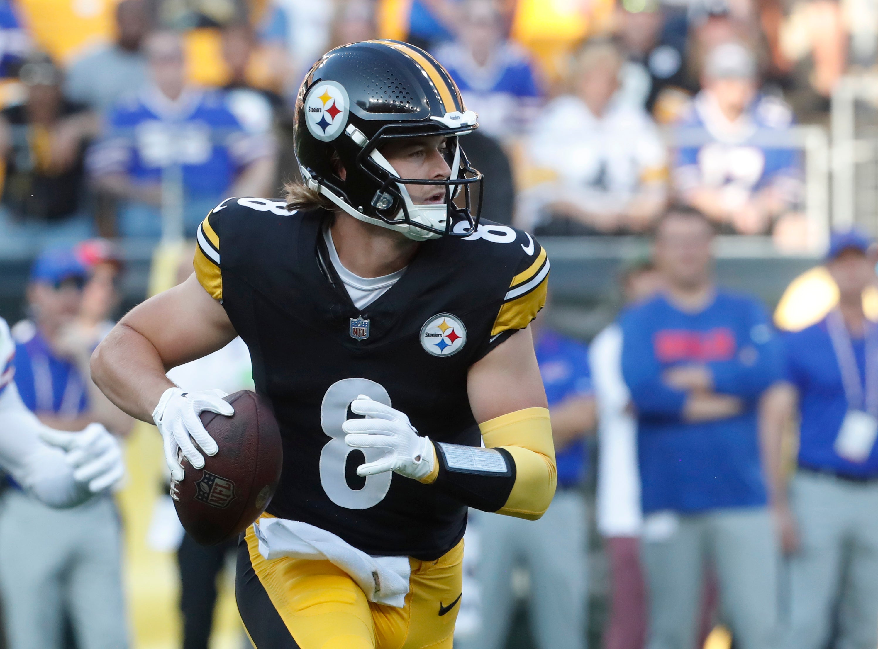 Aug 19, 2023; Pittsburgh, Pennsylvania, USA; Pittsburgh Steelers quarterback Kenny Pickett (8) scrambles with the ball against the Buffalo Bills during the first quarter at Acrisure Stadium. Mandatory Credit: Charles LeClaire-USA TODAY Sports  