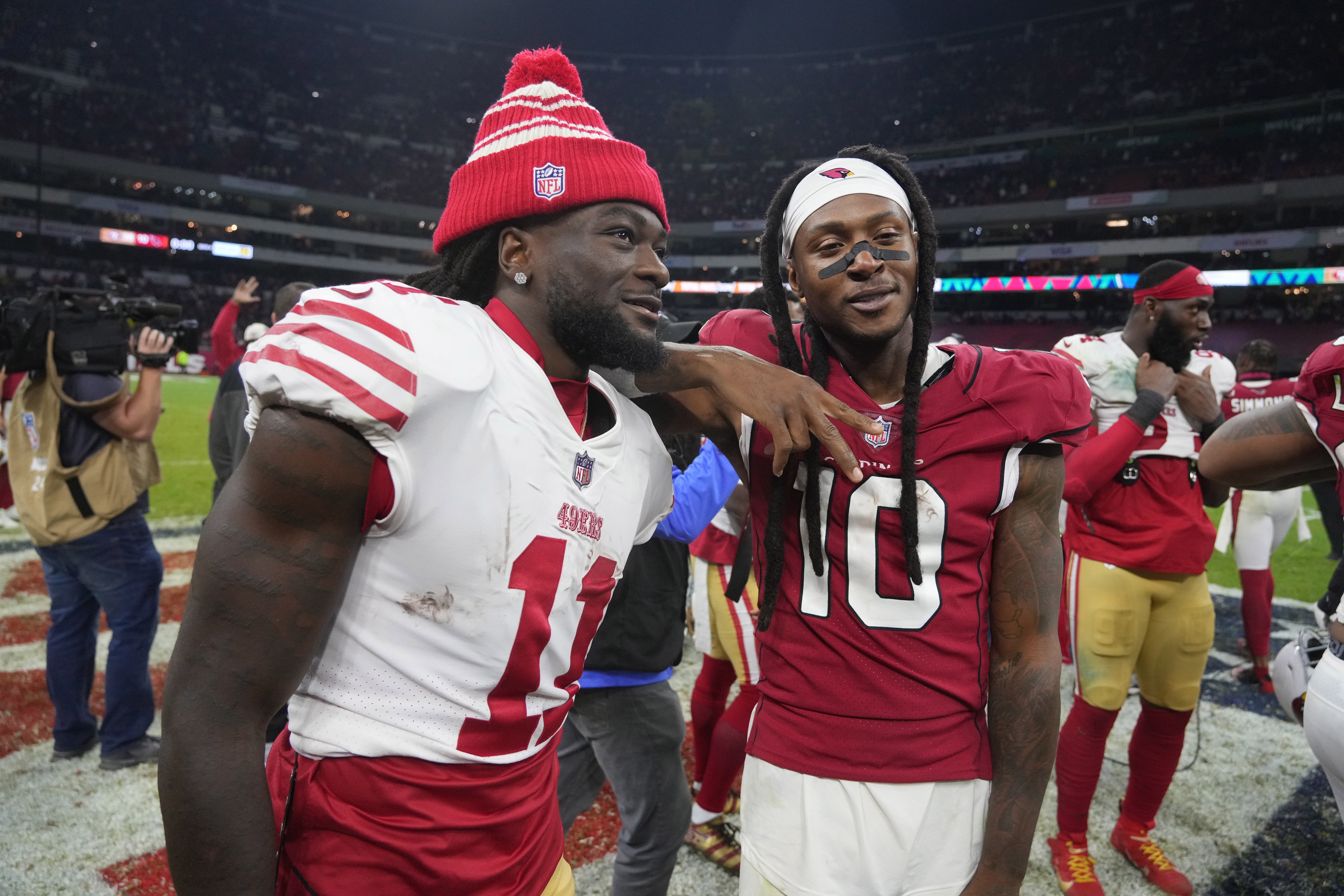 Nov 21, 2022; Mexico City, MEXICO; San Francisco 49ers wide receiver Brandon Aiyuk (11) and Arizona Cardinals wide receiver DeAndre Hopkins (10) react following the game at Estadio Azteca. Mandatory Credit: Kirby Lee-USA TODAY Sports