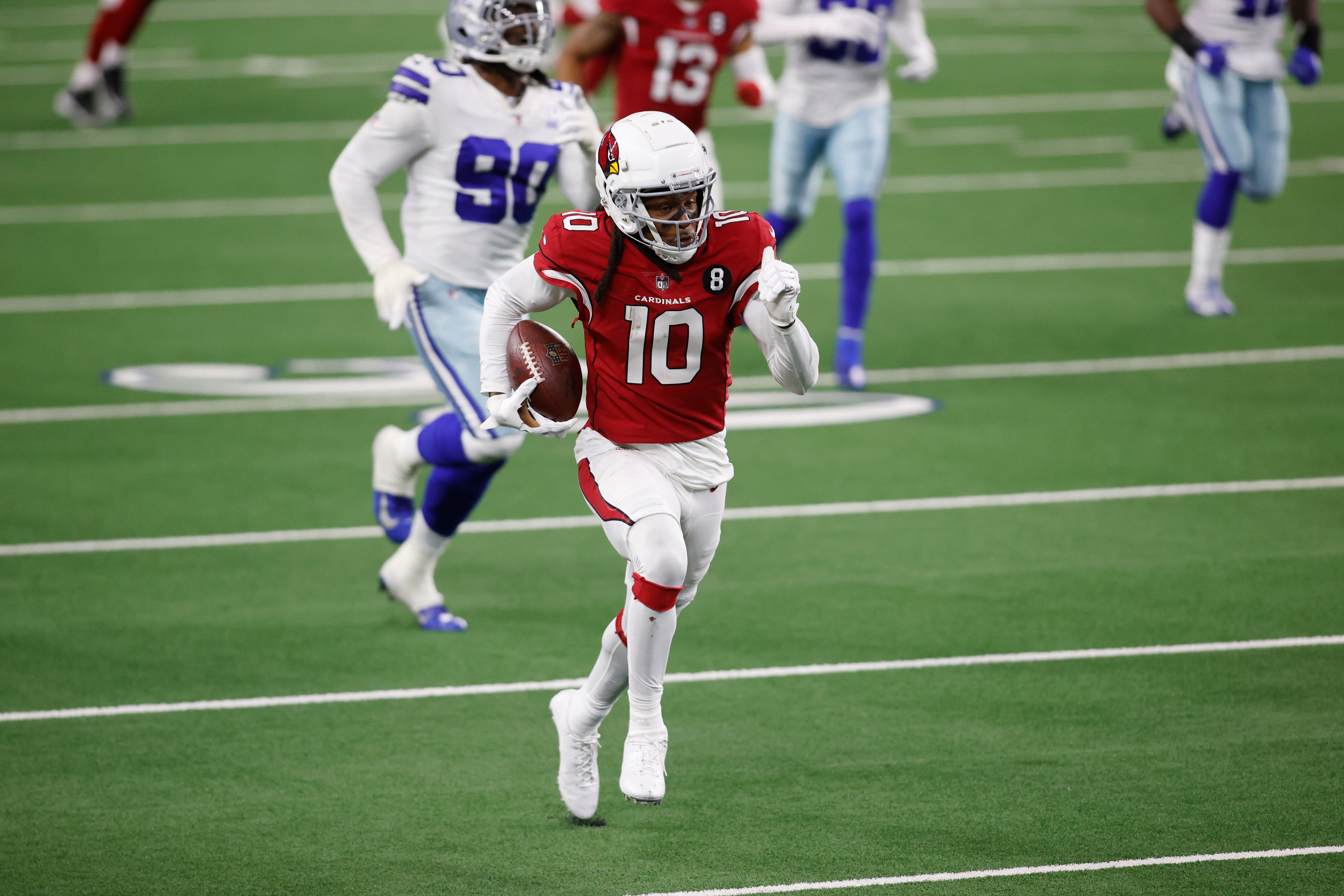 Arizona Cardinals wide receiver DeAndre Hopkins (10) runs the ball after a catch against the Dallas Cowboys in the fourth quarter at AT&T Stadium. Mandatory Credit: Tim Heitman-USA TODAY Sports