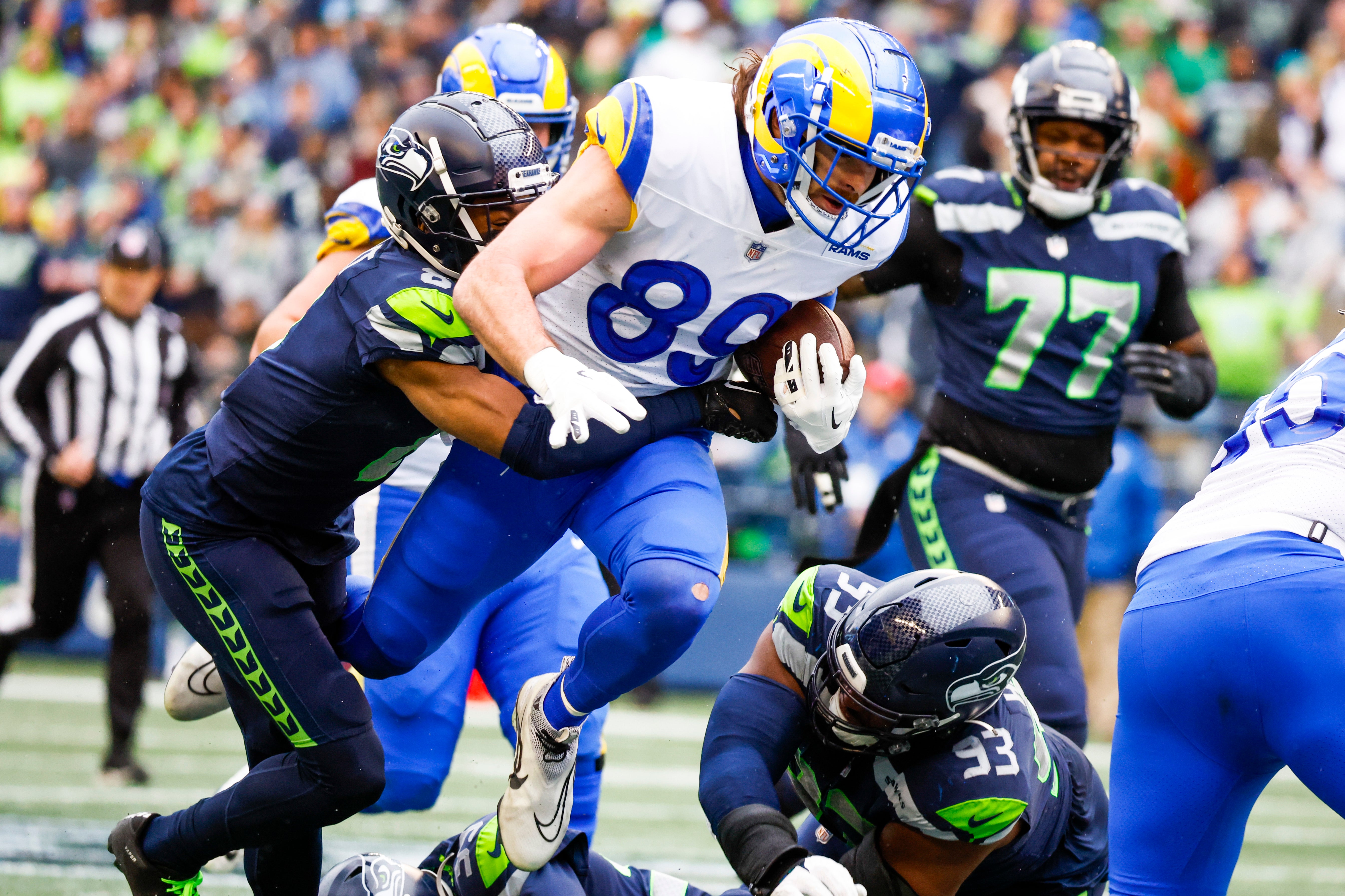 Los Angeles Rams tight end Tyler Higbee (89) runs for yards after the catch against Seattle Seahawks cornerback Coby Bryant (8) during the second quarter at Lumen Field. Mandatory Credit: Joe Nicholson-USA TODAY Sports