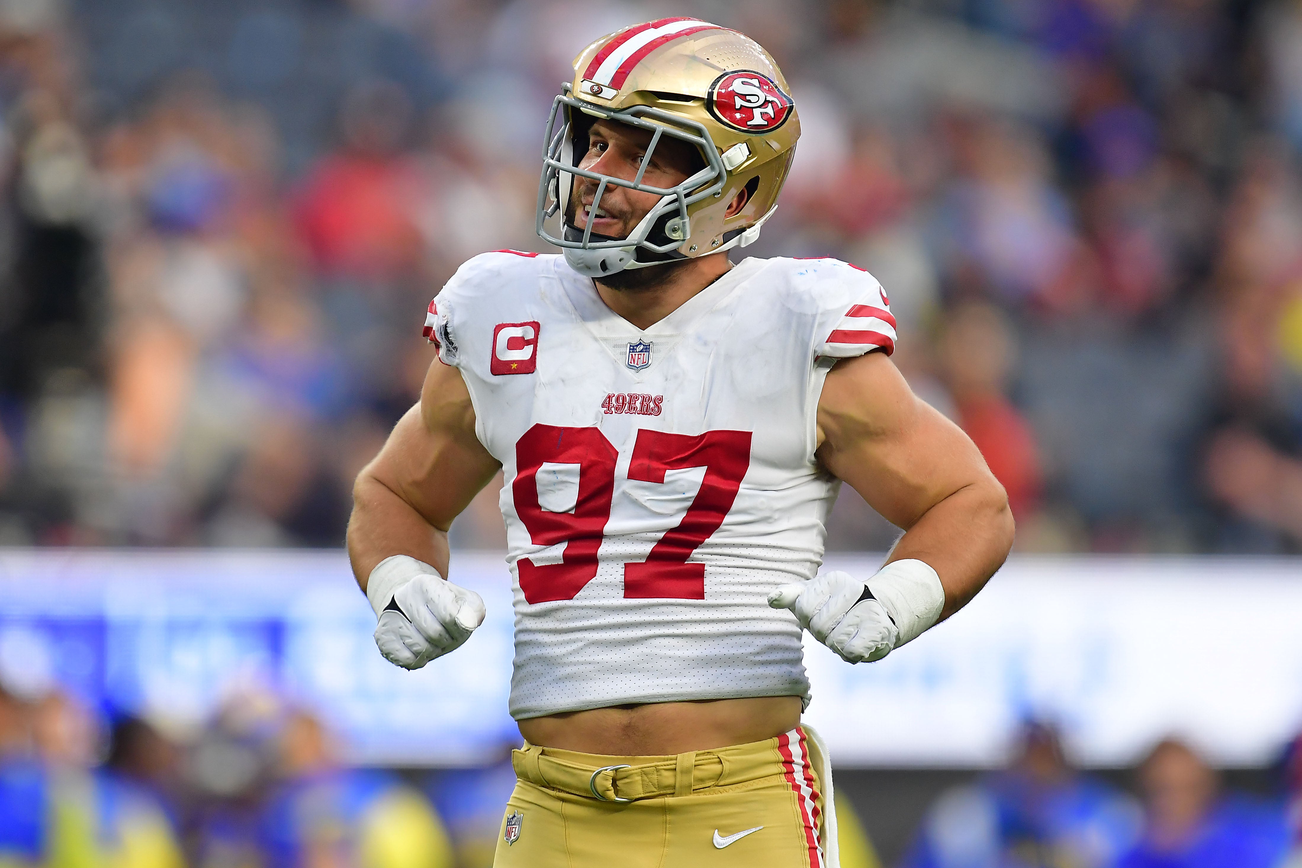 Oct 30, 2022; Inglewood, California, USA; San Francisco 49ers defensive end Nick Bosa (97) reacts after sacking Los Angeles Rams quarterback Matthew Stafford (9) during the second half at SoFi Stadium. Mandatory Credit: Gary A. Vasquez-USA TODAY Sports