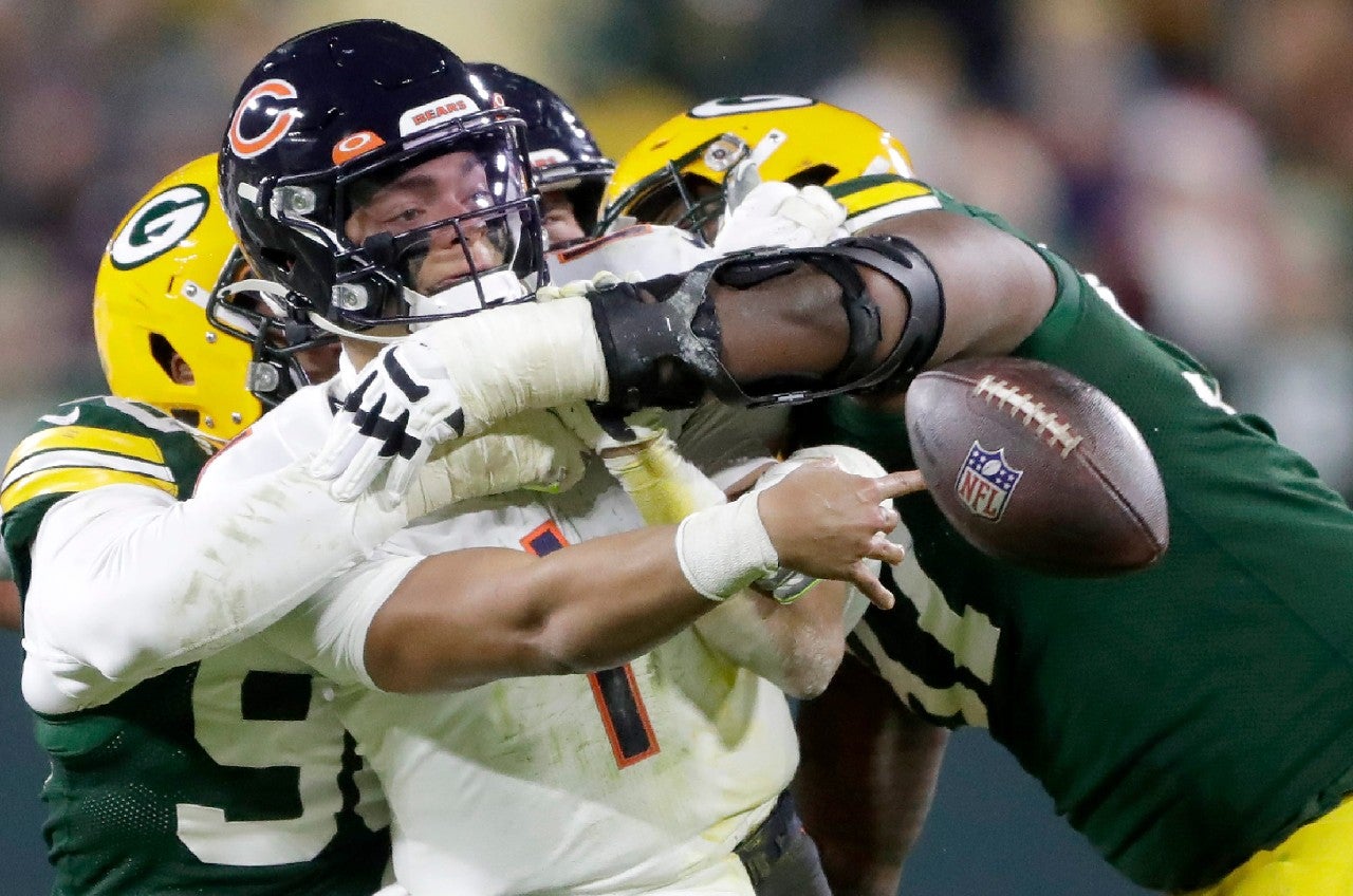 Chicago Bears quarterback Justin Fields (1) is sacked by Green Bay Packers defensive end Kingsley Keke (96) and nose tackle Kenny Clark (97) during their game on December 12, 2021, at Lambeau Field in Green Bay, Wis. Wm. Glasheen USA TODAY NETWORK-Wisconsin / USA TODAY NETWORK