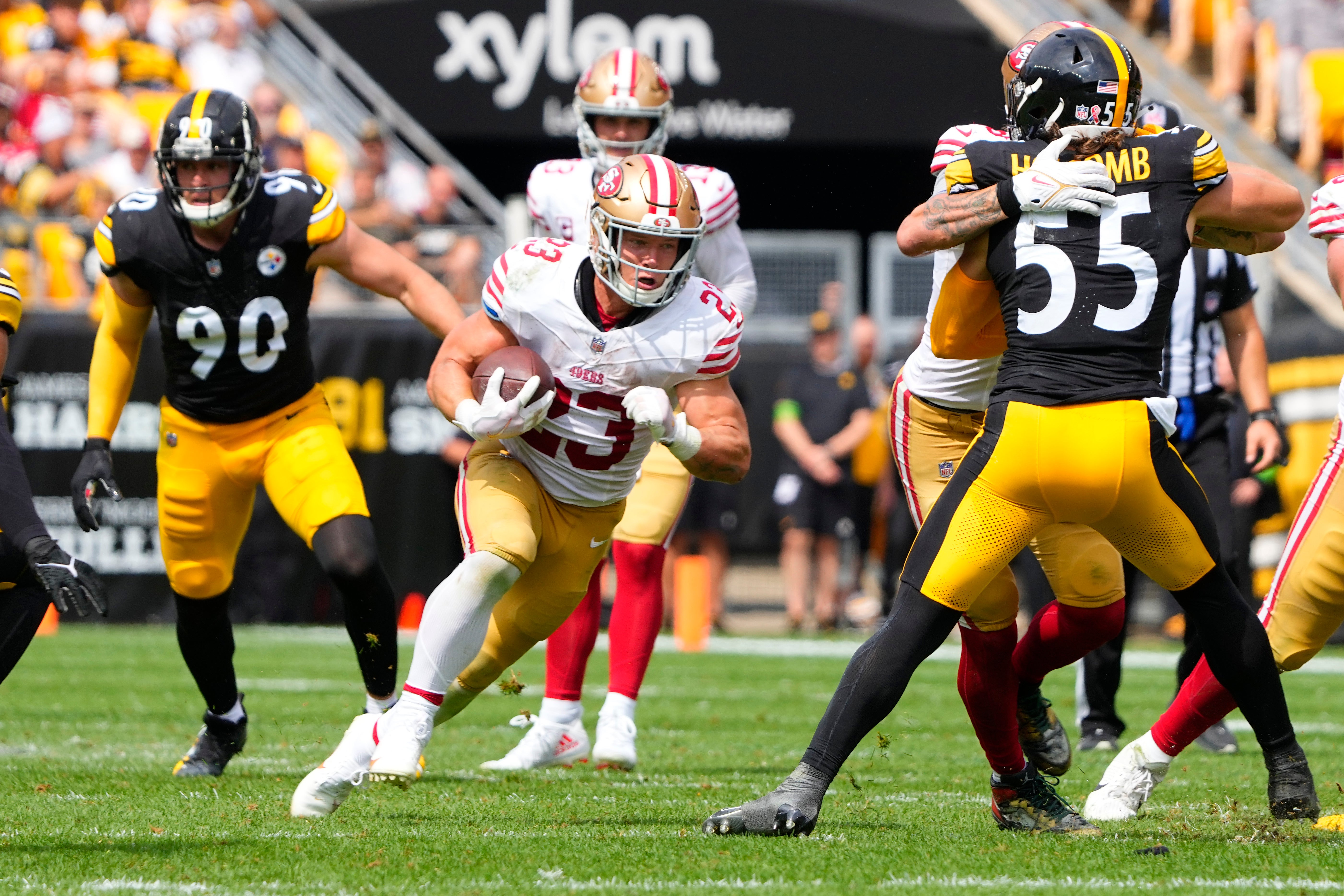 Sep 10, 2023; Pittsburgh, Pennsylvania, USA; San Francisco 49ers running back Christian McCaffrey (23) runs with the ball against the Pittsburgh Steelers during the first half at Acrisure Stadium. Mandatory Credit: Gregory Fisher-USA TODAY Sports