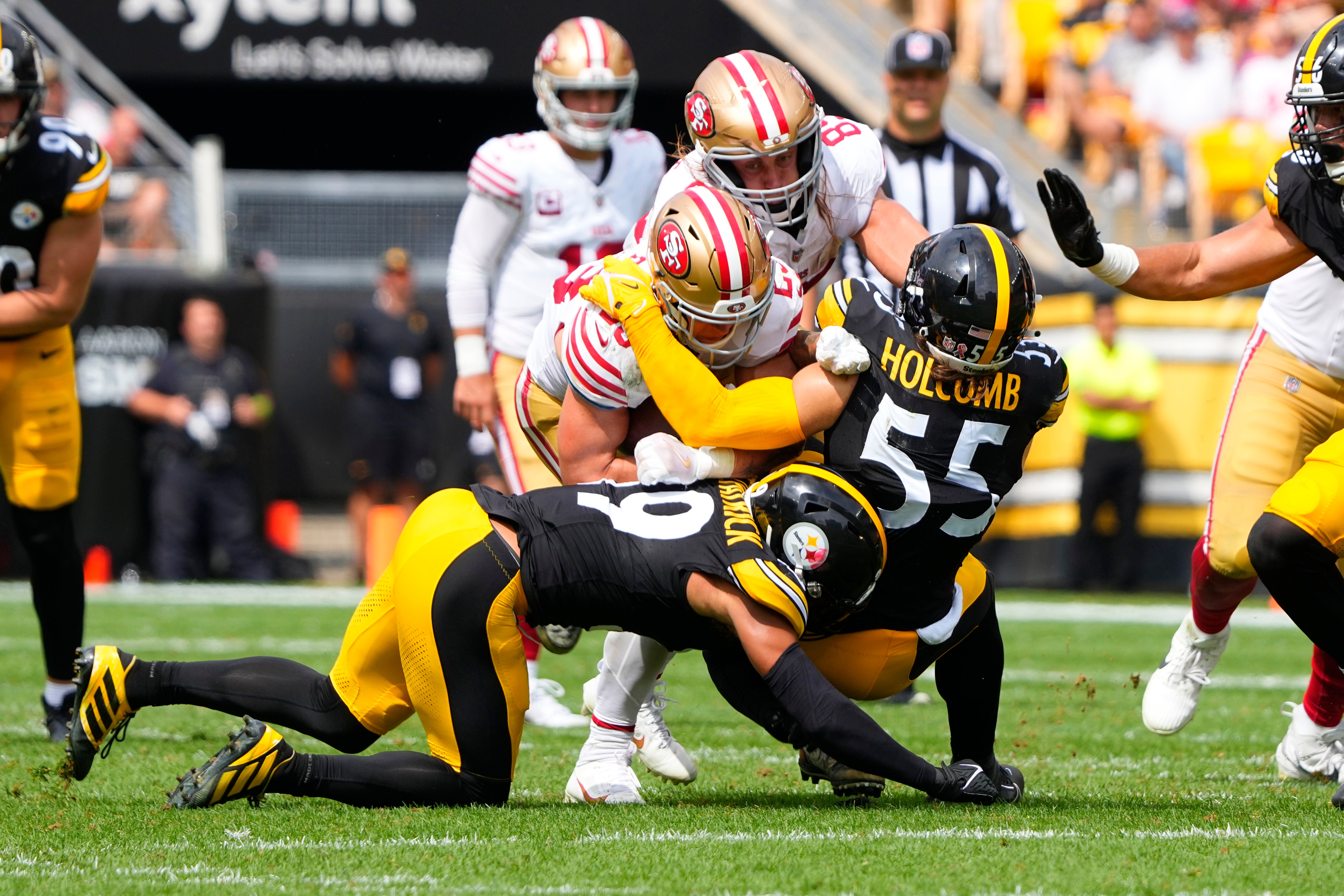 Sep 10, 2023; Pittsburgh, Pennsylvania, USA; Pittsburgh Steelers linebacker Cole Holcomb (55) tackles San Francisco 49ers running back Christian McCaffrey (23) during the first half at Acrisure Stadium. Mandatory Credit: Gregory Fisher-USA TODAY Sports