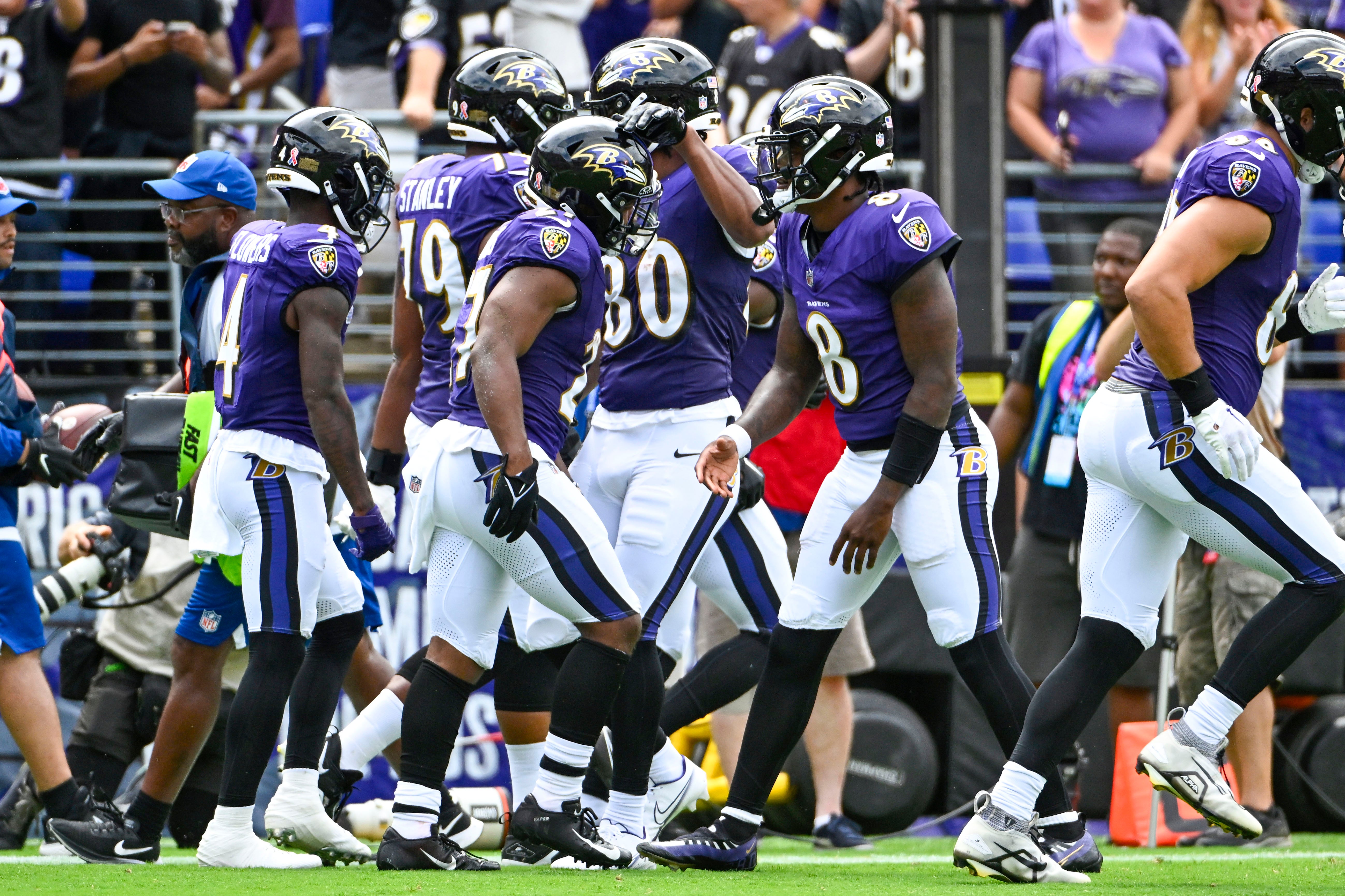 Sep 10, 2023; Baltimore, Maryland, USA; Baltimore Ravens running back J.K. Dobbins (27) is congratulated by quarterback Lamar Jackson (8) after scoring a touchdown against the Houston Texans during the first half at M&T Bank Stadium. Mandatory Credit: Brad Mills-USA TODAY Sports