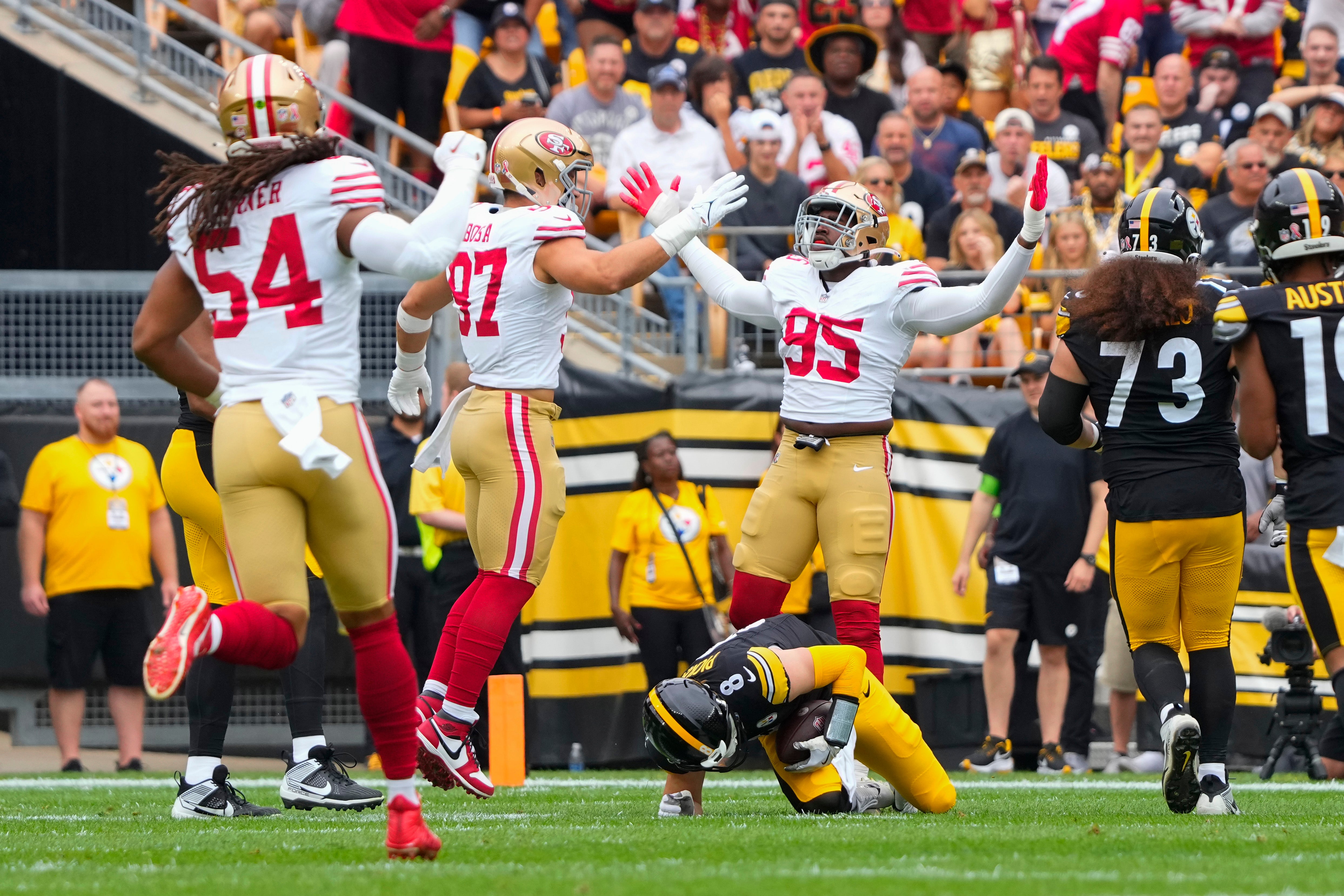 Sep 10, 2023; Pittsburgh, Pennsylvania, USA; San Francisco 49ers defensive end Drake Jackson (95) reacts to sacking Pittsburgh Steelers quarterback Kenny.Pickett (8) along with San Francisco 49ers defensive end Nick Bosa (97) during the first half at Acrisure Stadium. Mandatory Credit: Gregory Fisher-USA TODAY Sports