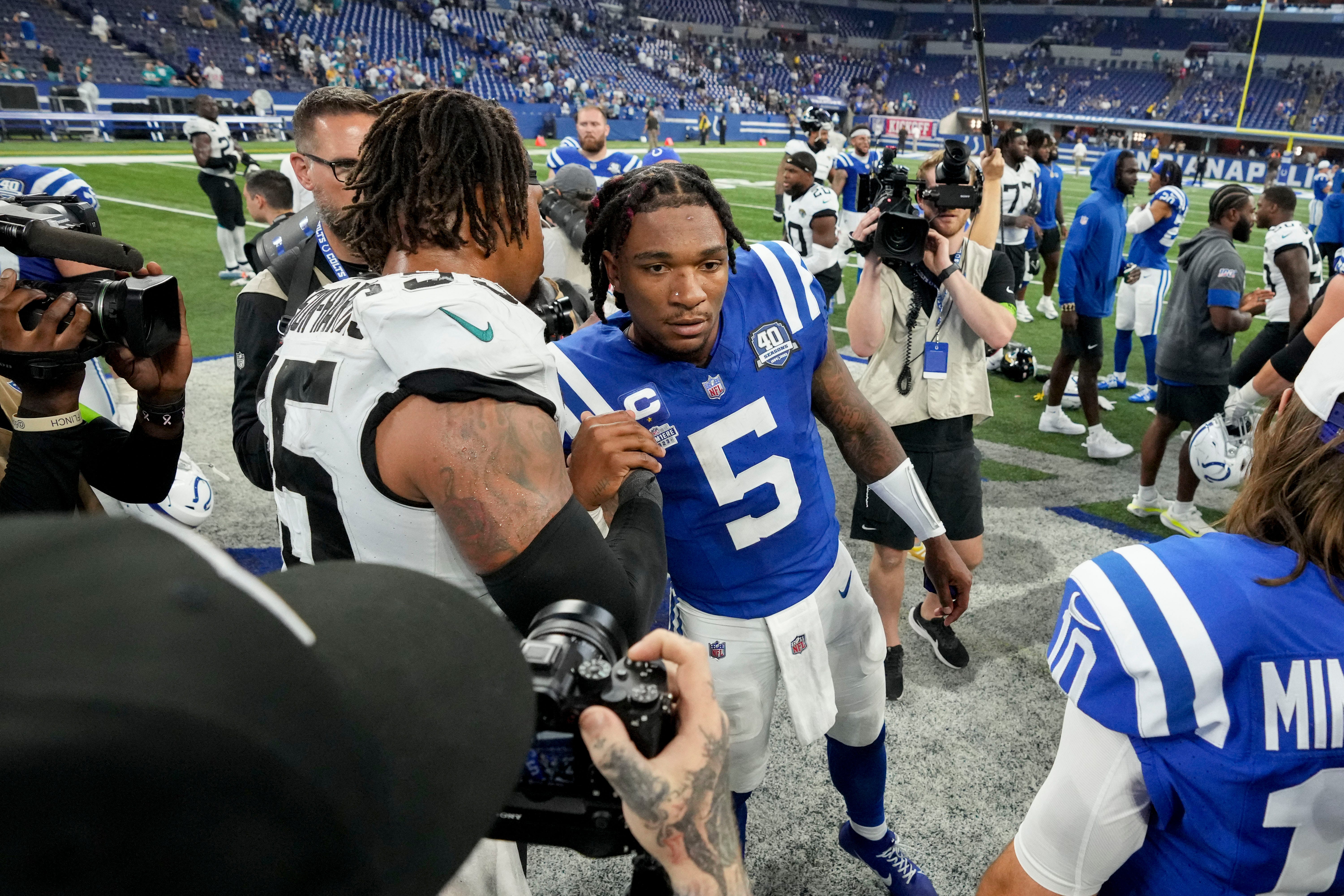 Jacksonville Jaguars defensive end Roy Robertson-Harris (95) and Indianapolis Colts quarterback Anthony Richardson (5) shake hands as they leave the field Sunday, Sept. 10, 2023, during a game against the Jacksonville Jaguars at Lucas Oil Stadium in Indianapolis.
