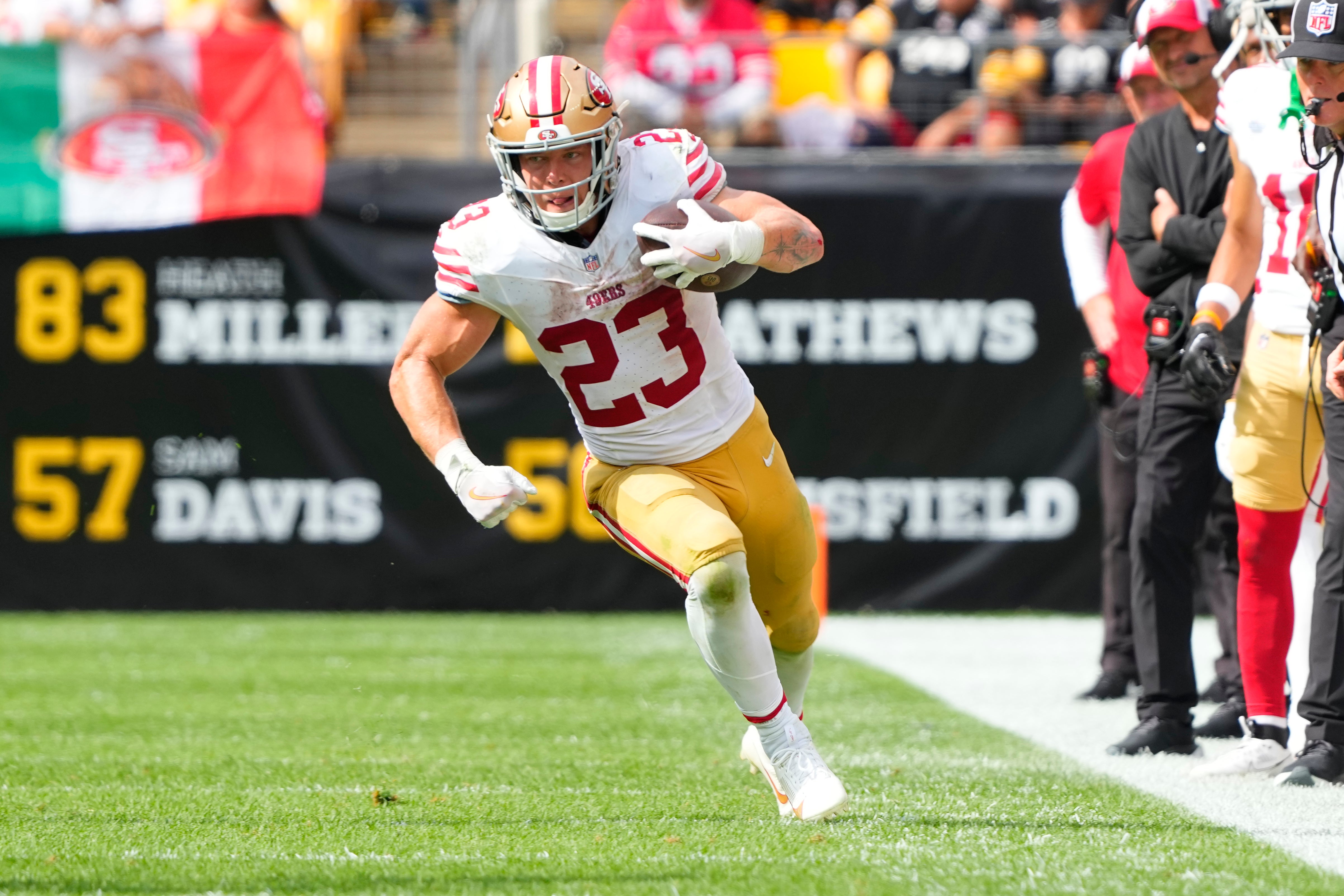 Sep 10, 2023; Pittsburgh, Pennsylvania, USA; San Francisco 49ers running back Christian McCaffrey (23) runs with the ball against the Pittsburgh Steelers during the second half at Acrisure Stadium. Mandatory Credit: Gregory Fisher-USA TODAY Sports