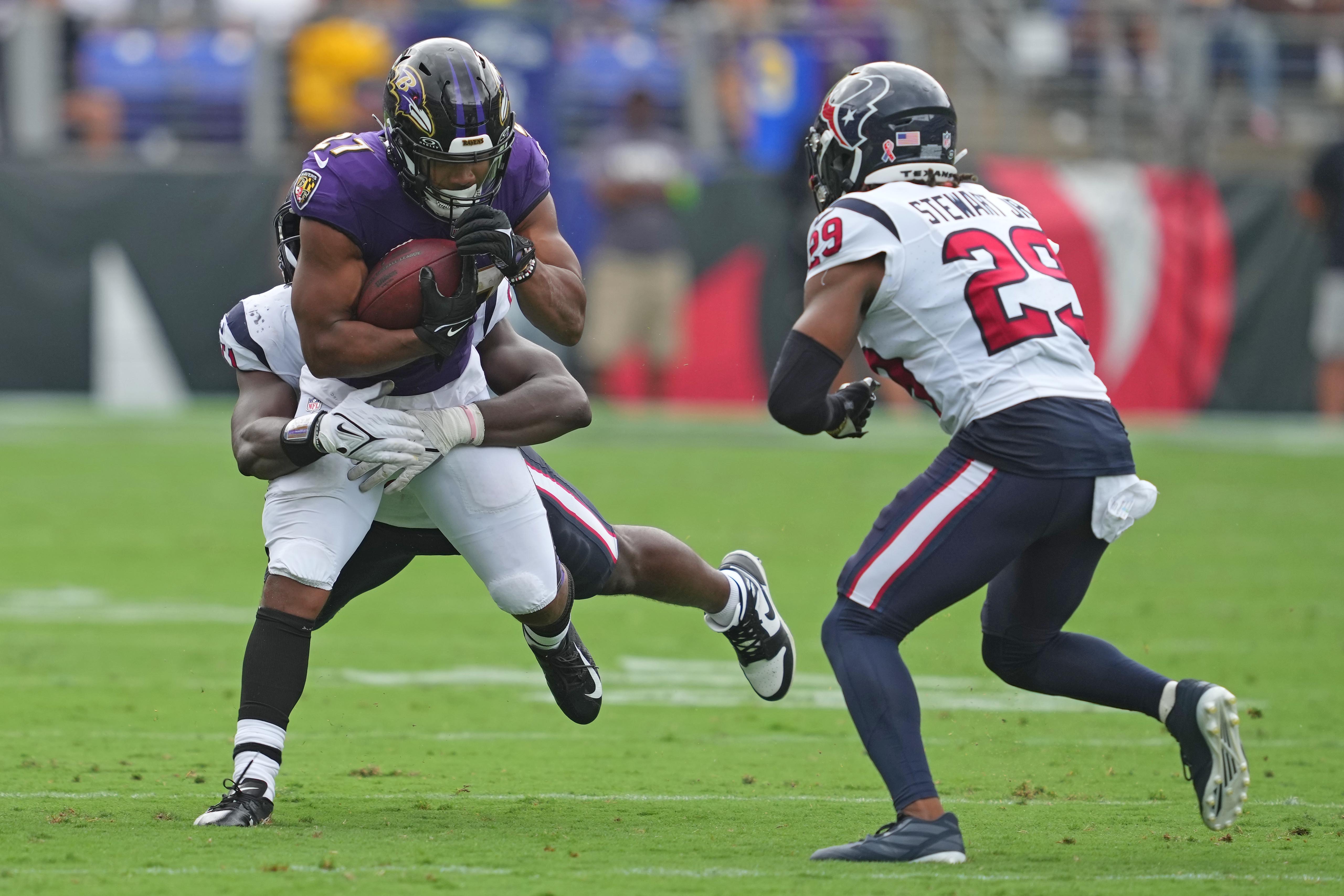Sep 10, 2023; Baltimore, Maryland, USA; Baltimore Ravens running back J.K. Dobbins (27) runs for a gain in the fourth quarter against the Houston Texans at M&T Bank Stadium. Mandatory Credit: Mitch Stringer-USA TODAY Sports