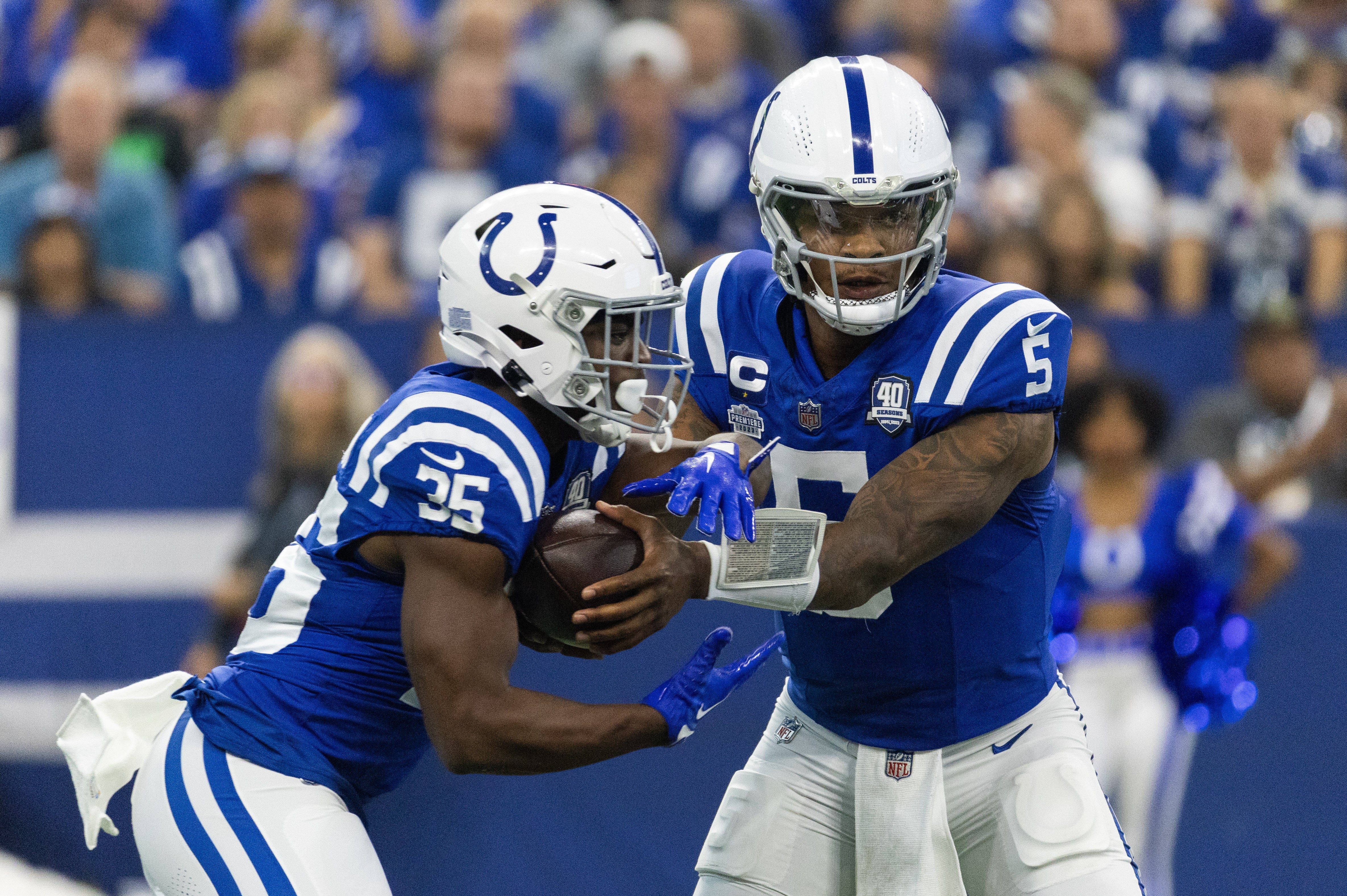 Sep 10, 2023; Indianapolis, Indiana, USA; Indianapolis Colts quarterback Anthony Richardson (5) hands the ball off to running back Deon Jackson (35) in the first quarter against the Jacksonville Jaguars at Lucas Oil Stadium.